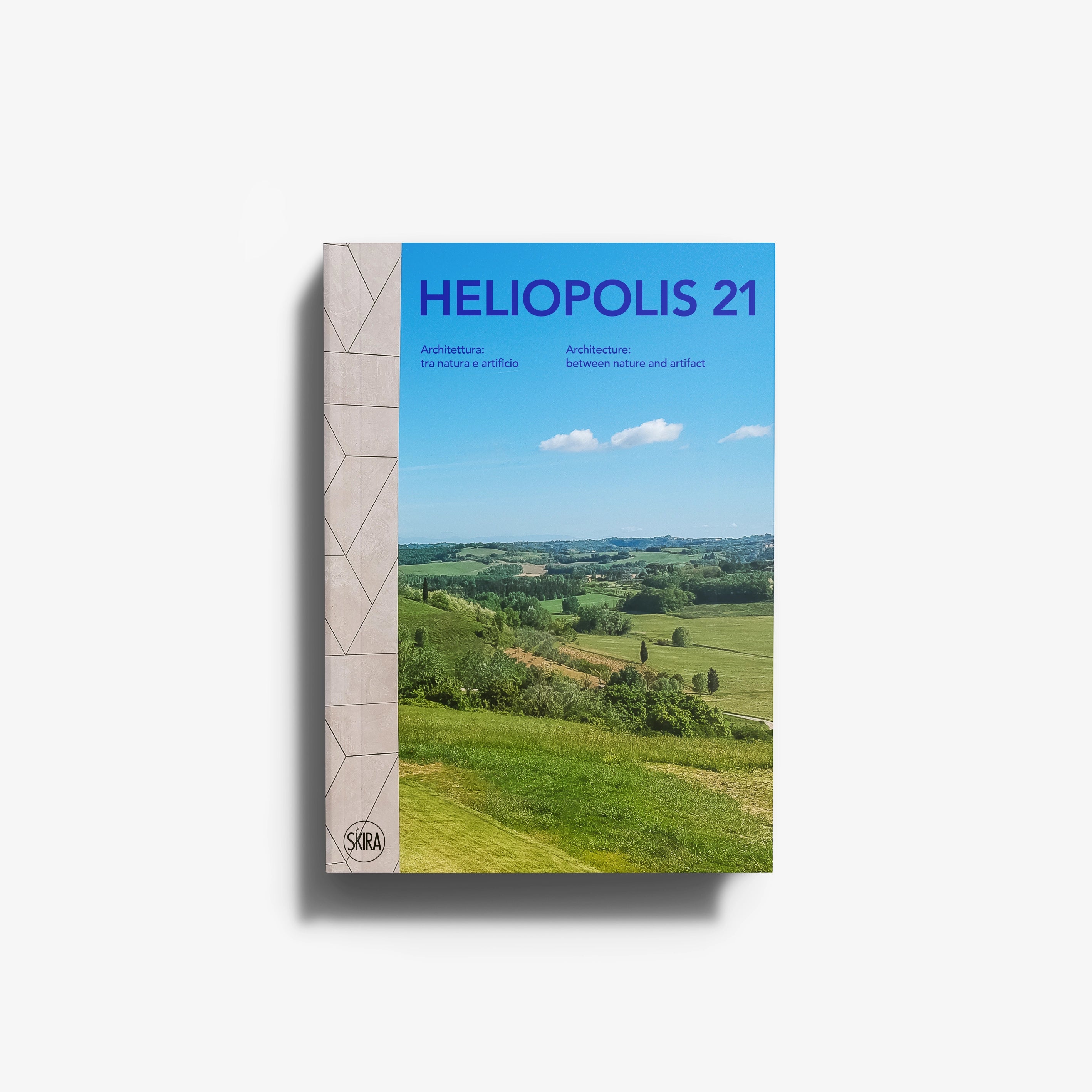 Art book Helio polis 21 by Skira Arte with blue cover showing architecture between nature and artifact
