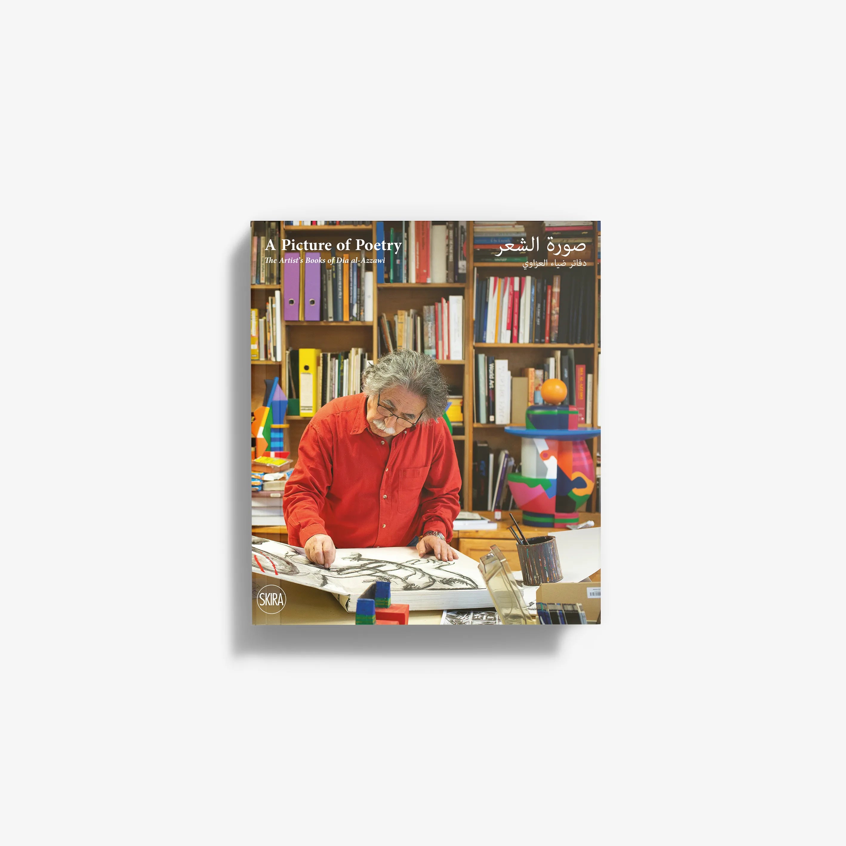 Contemporary art book collection by Skira Arte, hardcover format, with artist Dia Al-Azzawi working at a desk