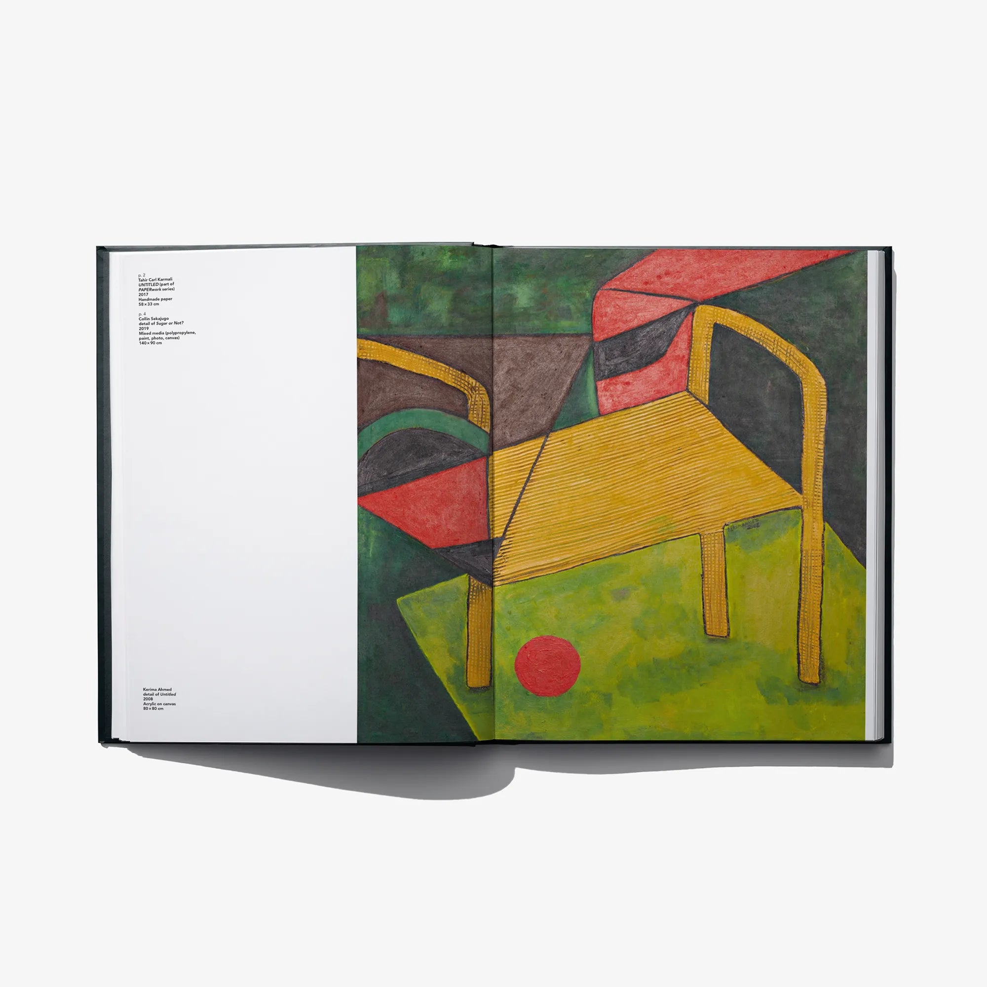 Open art book spread with colorful abstract figures, yellow chair, and red circle