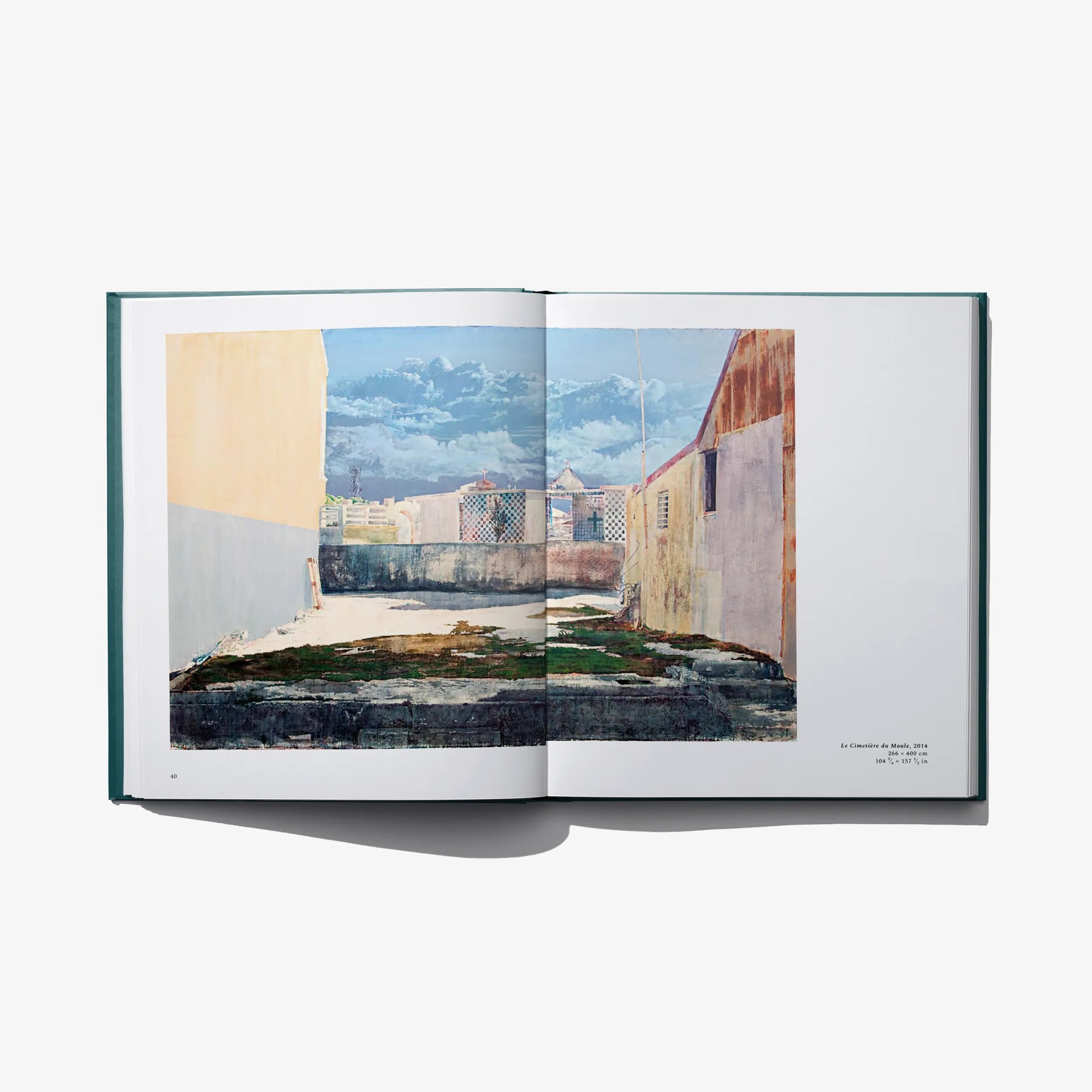 Open art book spread with illustrated buildings and courtyard scene across pages