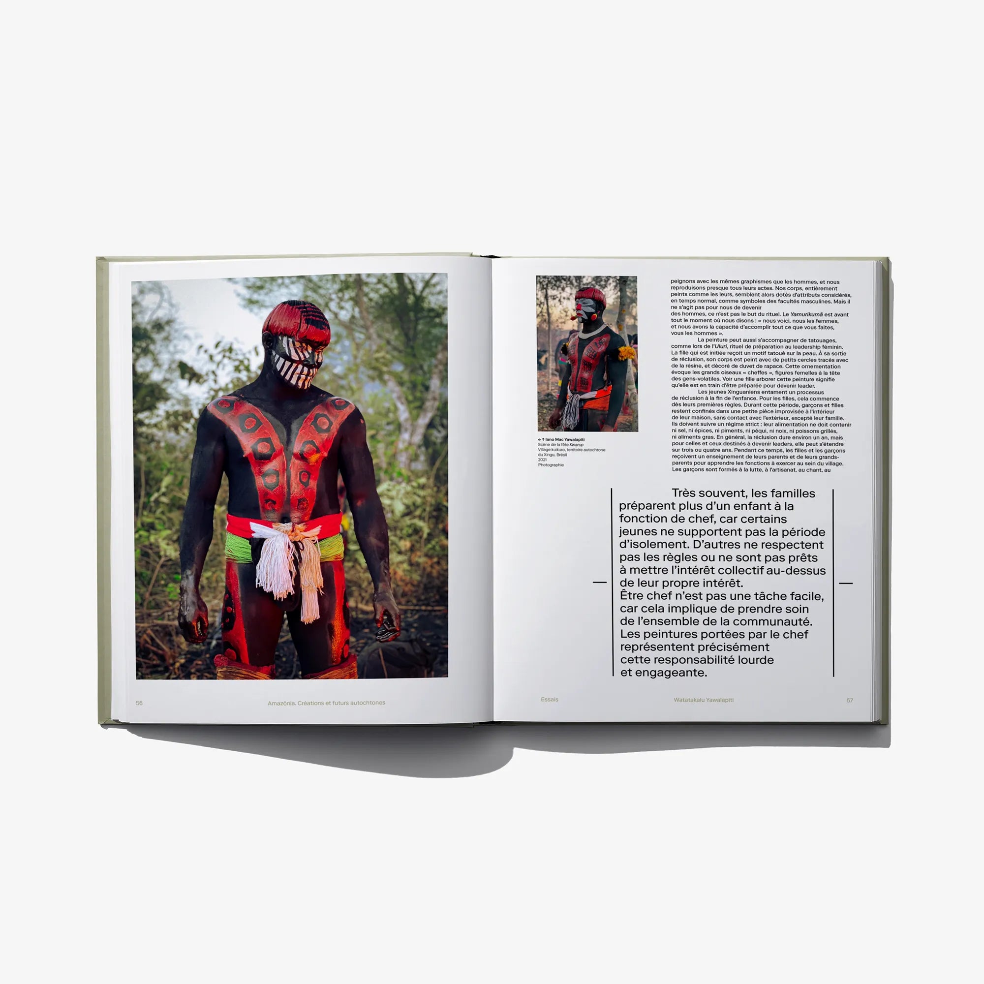 Open Amazonia book showing full-page portrait photos and a text panel