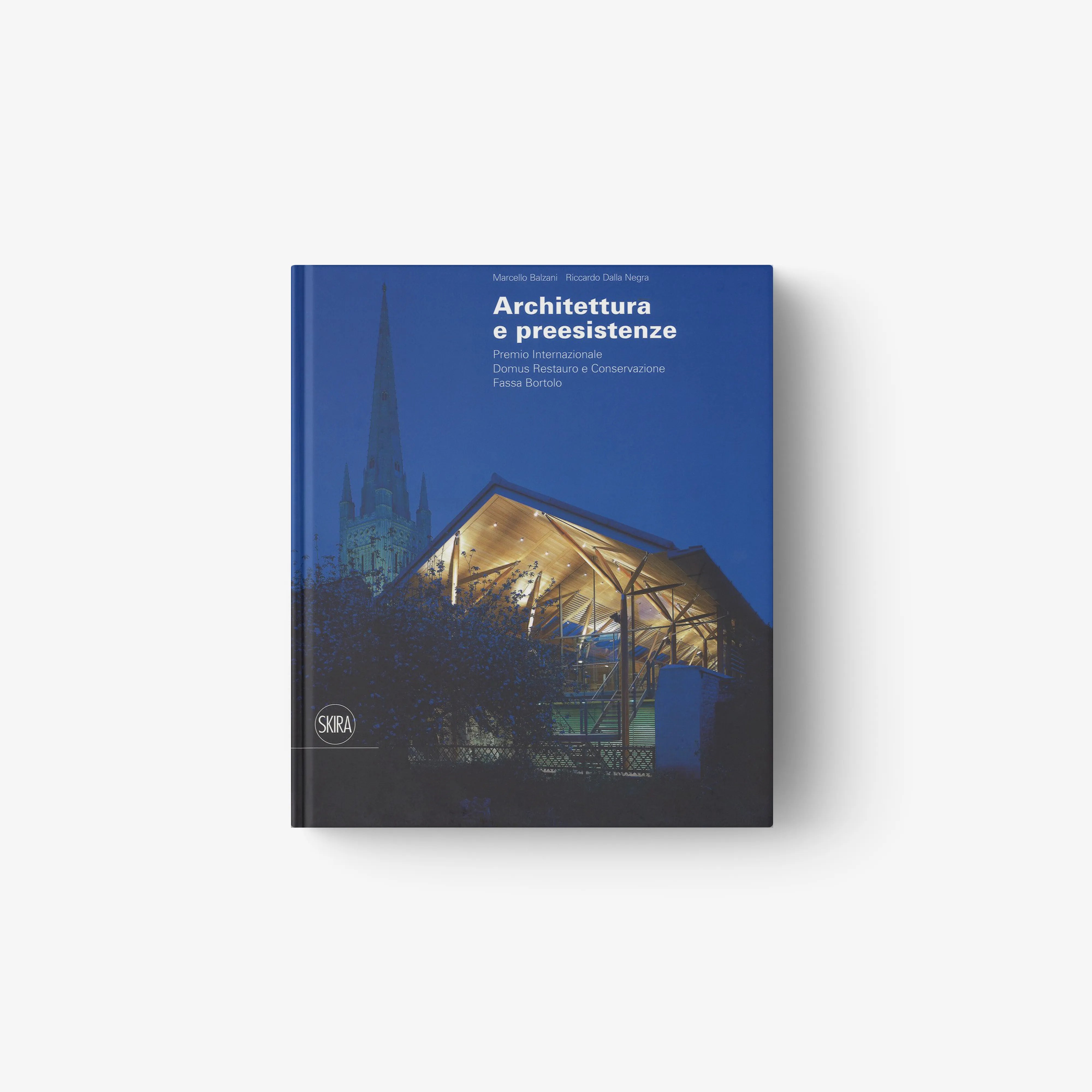 Hardback art and architecture book by Skira Arte with blue cover showing cathedral skyline and illuminated glass pavilion
