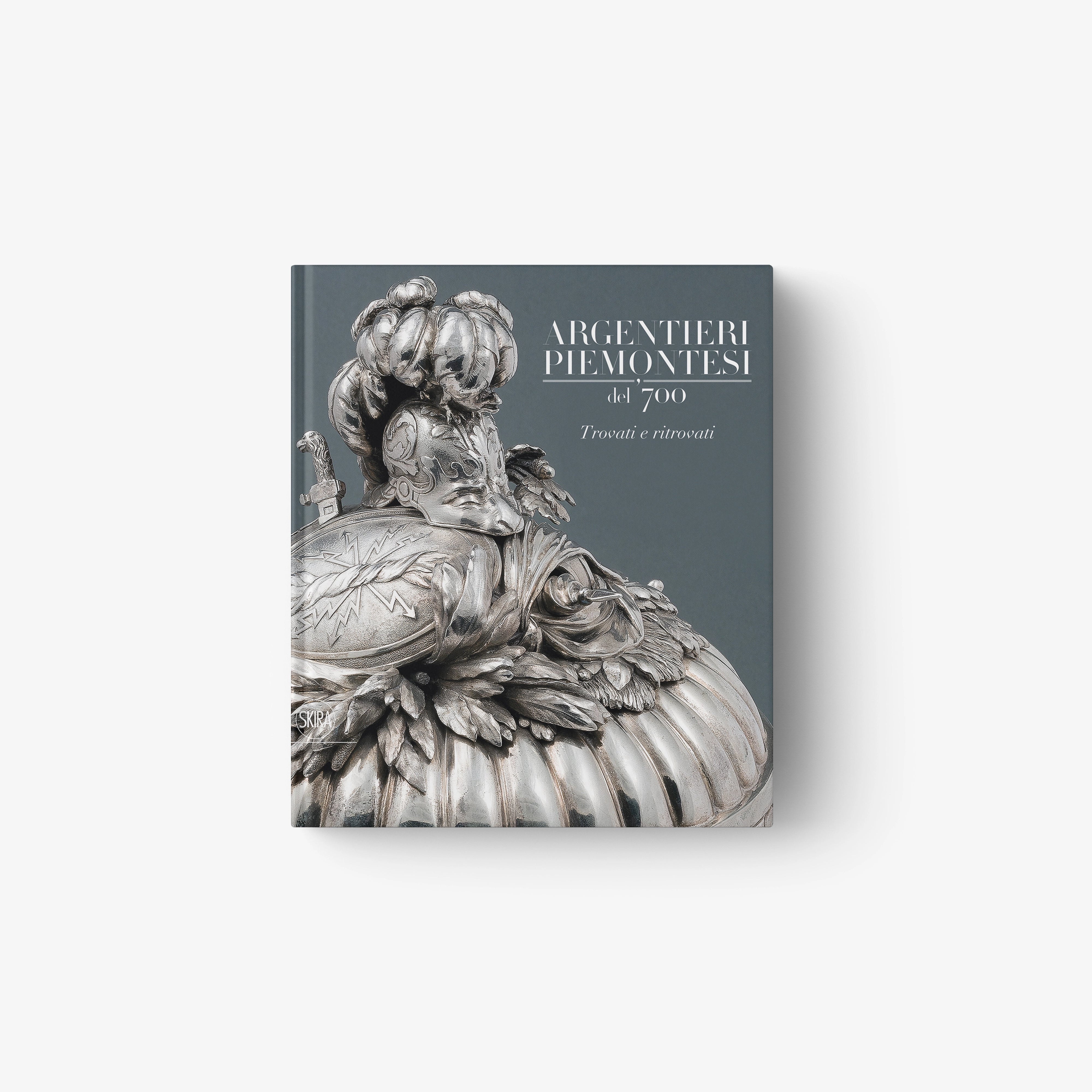 Dark blue hardcover book with silver engraved portrait cover artwork