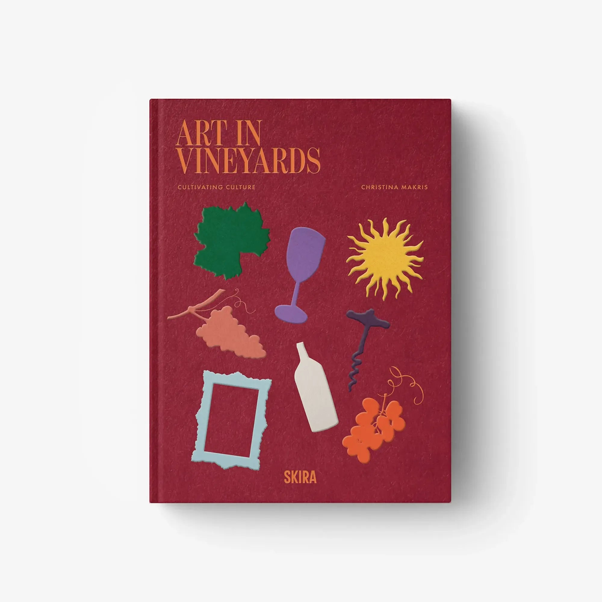 Maroon book cover with illustrated wineglass, sun, grapes, bottle and label graphics.