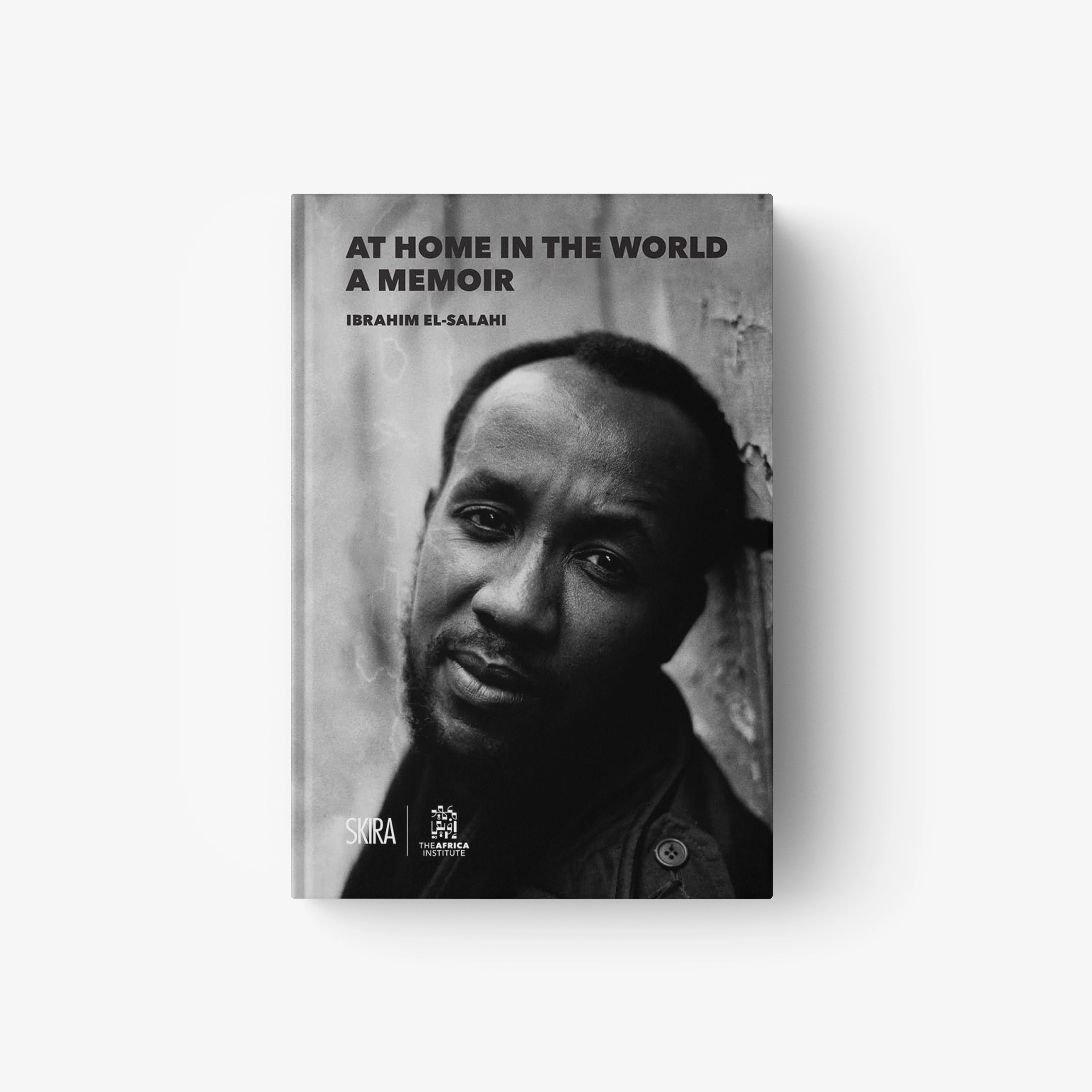 Memoir book with grayscale portrait cover and title AT HOME IN THE WORLD