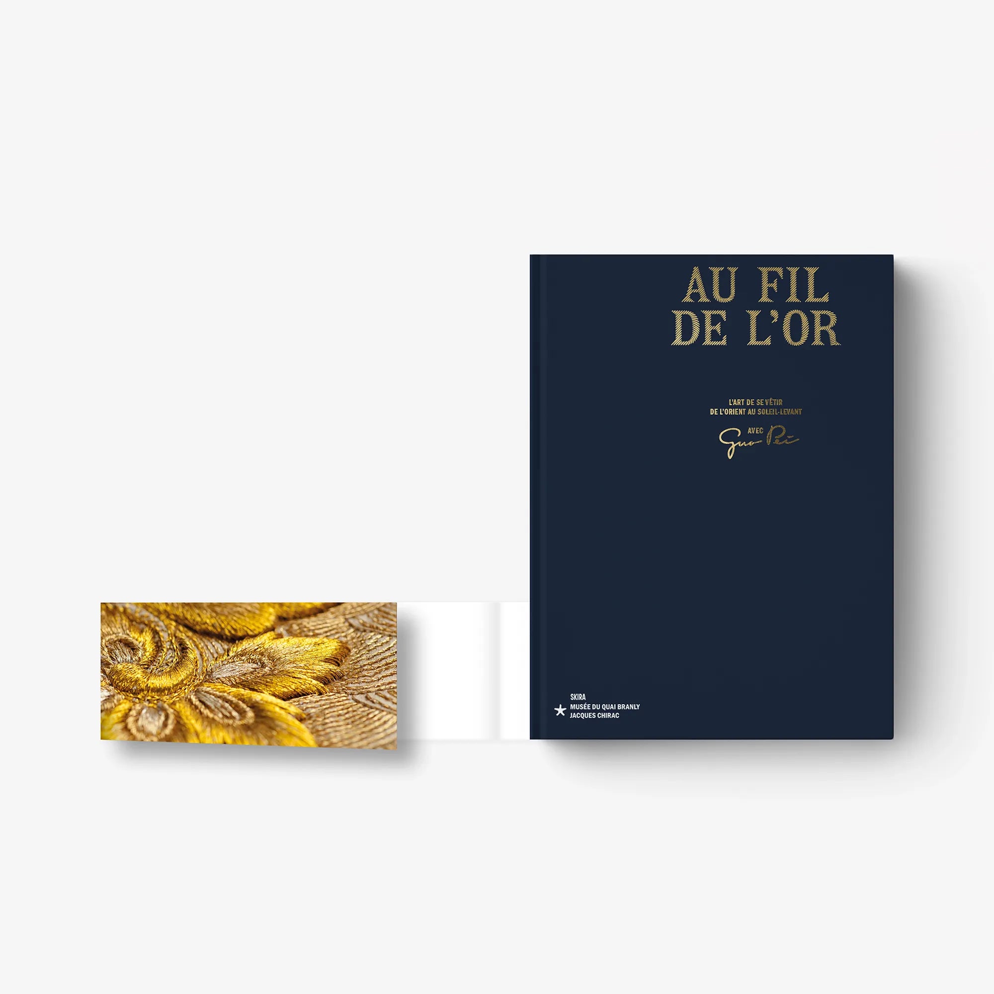Au Fil de L'Or hardcover book cover in navy with gold lettering