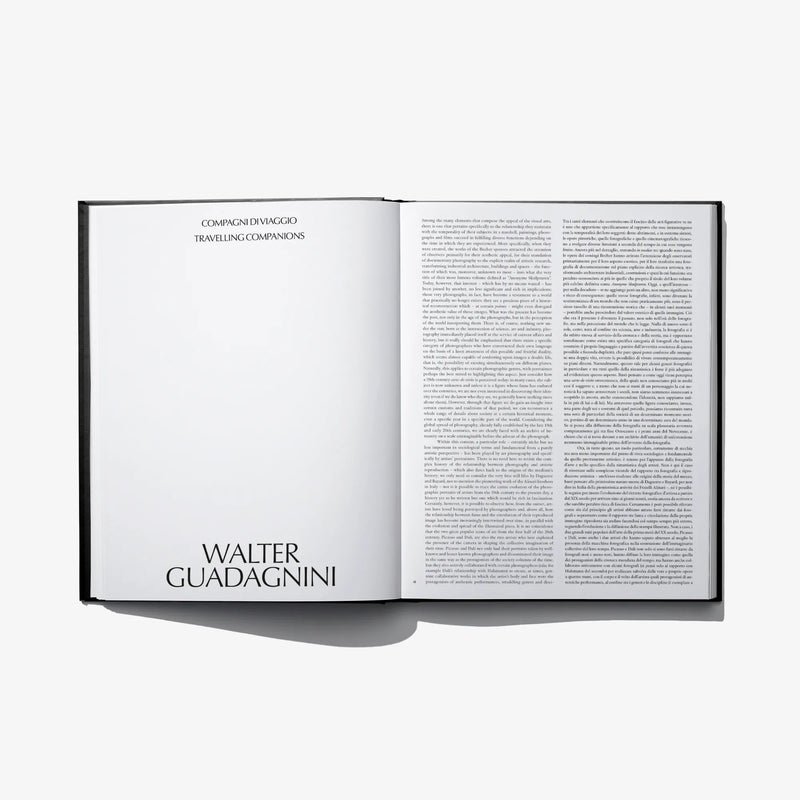 Open hardcover photo book with page heading 'Walter Guadagnini' and text