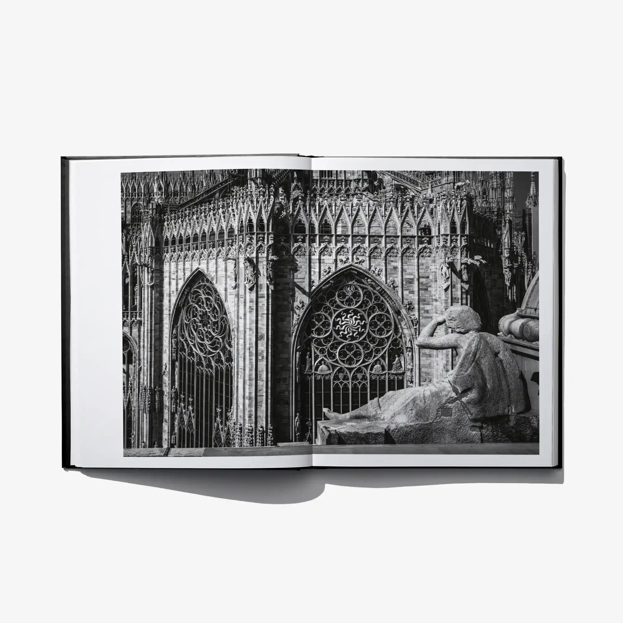 Aurelio Amendola photo book open to a black-and-white cathedral facade spread