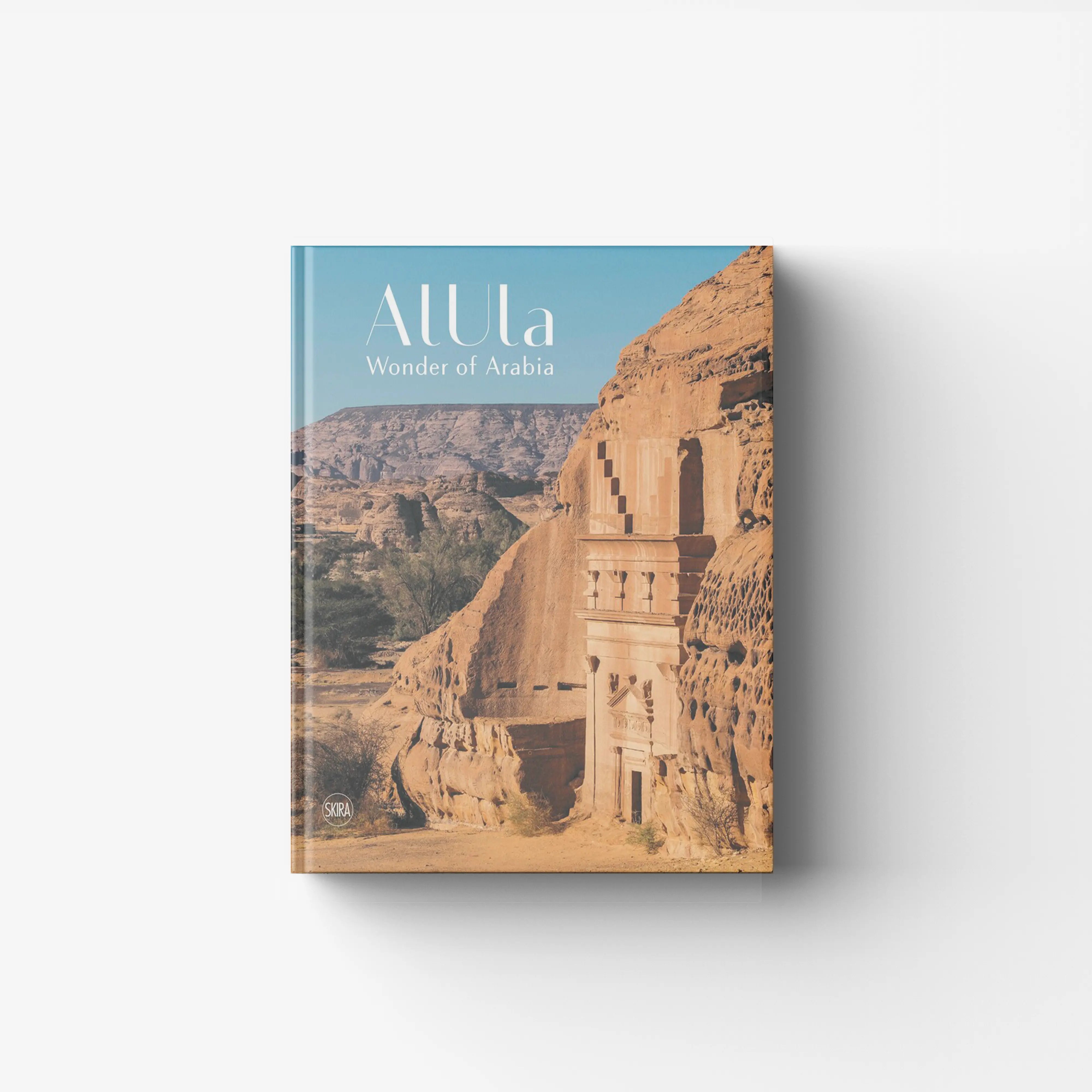 Ancient art book in blue and sandy tones by Skira Arte, with historical site focus AlUla and Hegra