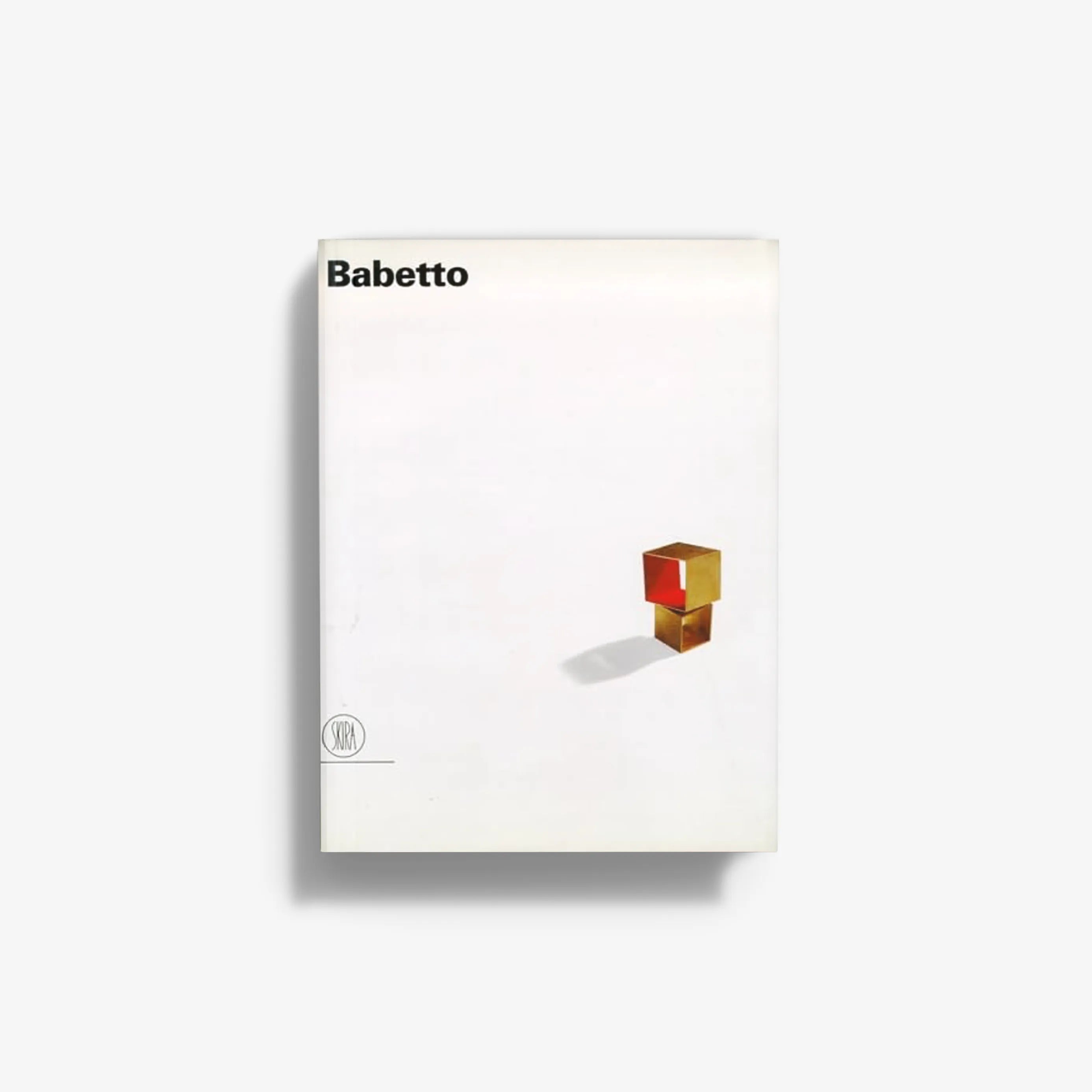 Contemporary sculpture book cover by Skira Arte, Giampaolo Babetto, with gold and red cube artwork