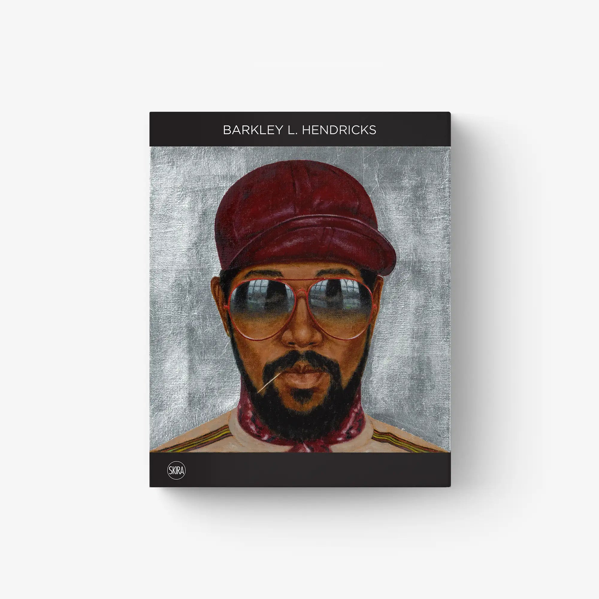 Framed portrait print of a man with a red cap and round blue-tinted glasses