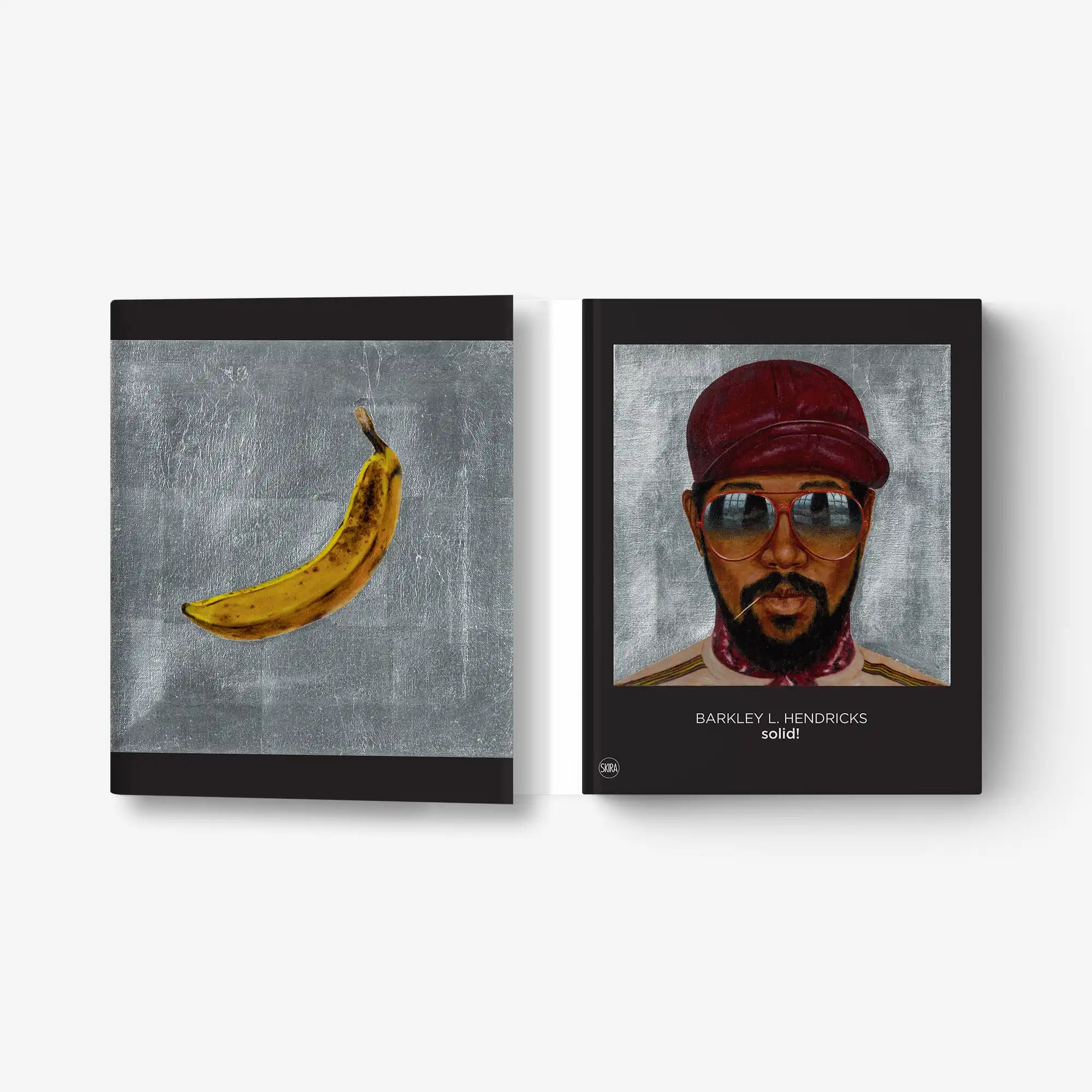 Set of two framed prints: a yellow banana and a man in a red cap with glasses