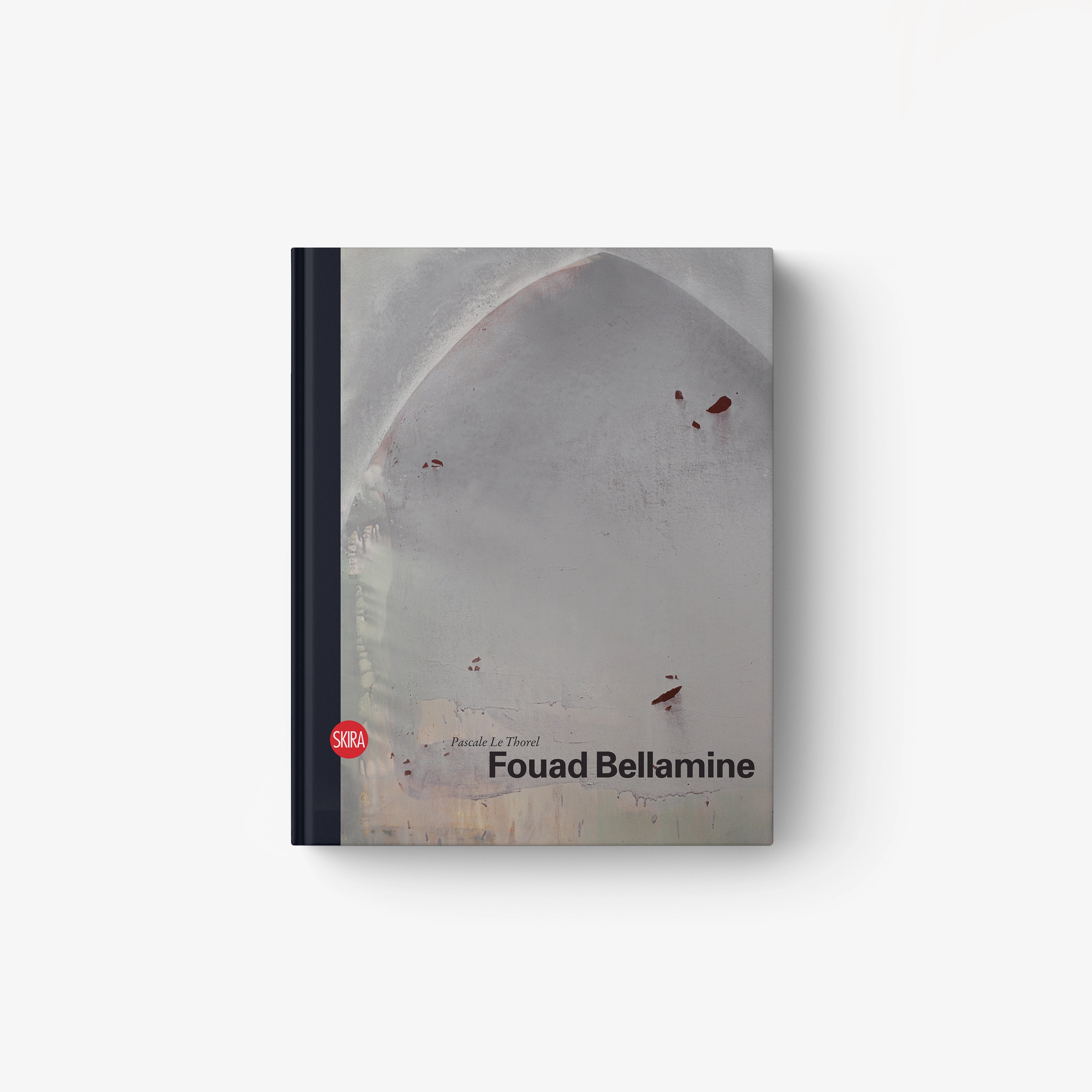 Hardcover book with gray abstract cover and red accents, titled Fouad Bellamine
