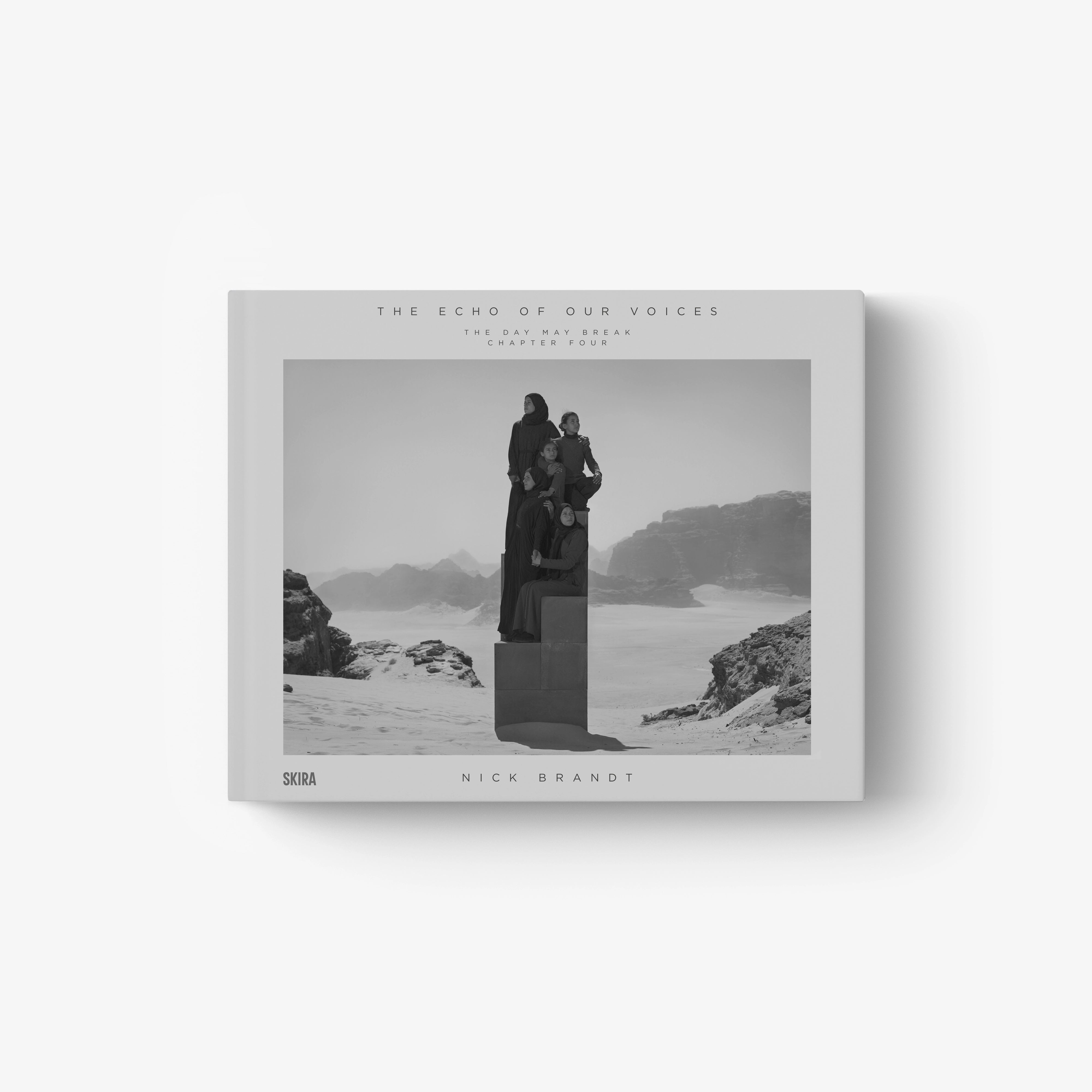 Hardcover photo book with black-and-white scenic cover and title text