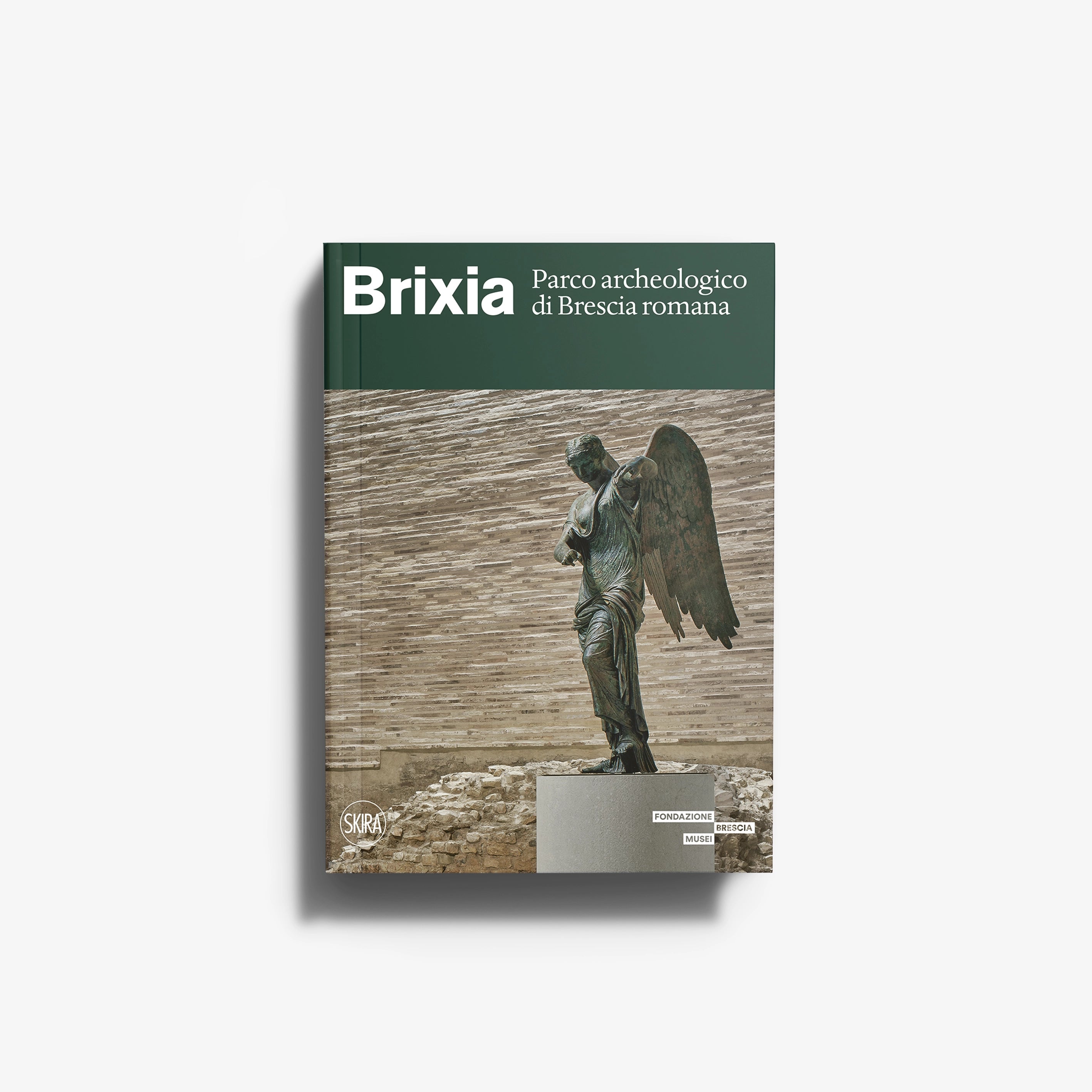 Tourist guide book in Italian archaeological park, dark green cover with statue, Skira Arte, Capitolium and Roman theatre content