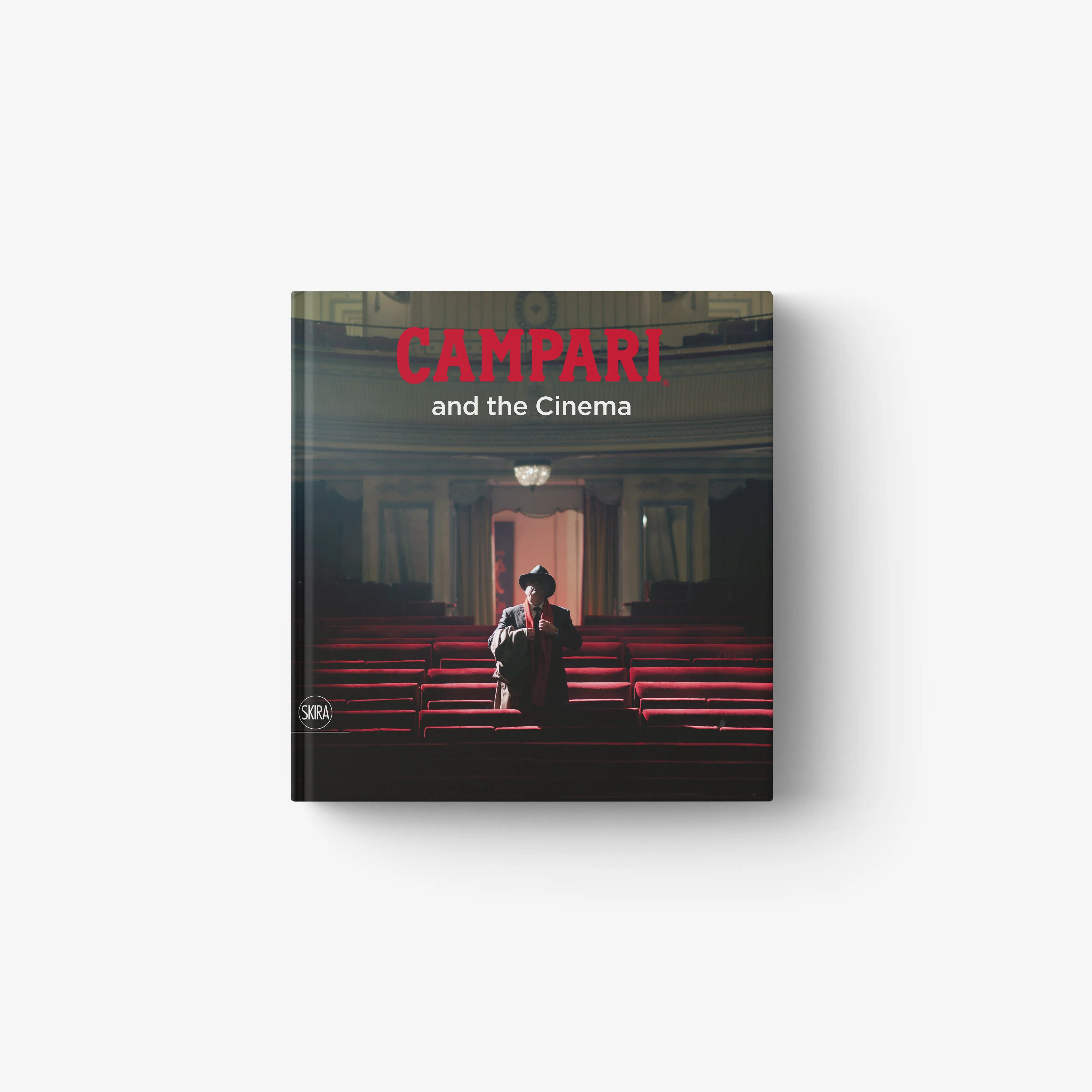 Cinema art book by Skira Arte with Campari title on cover, featuring a man in a theatre with red seats