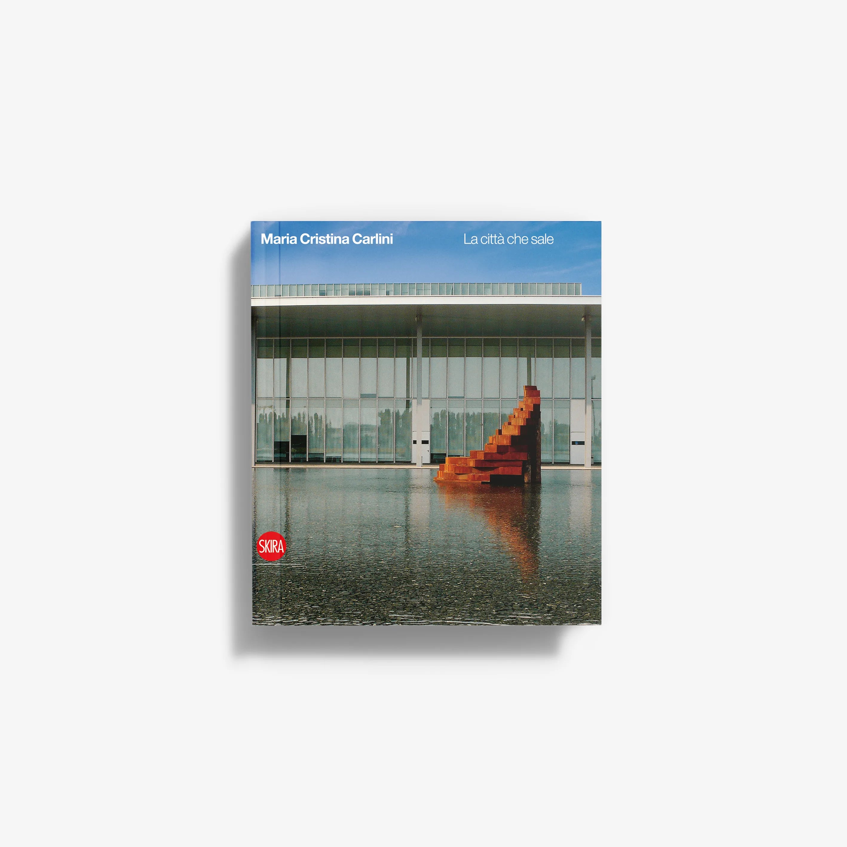 Paperback book cover with blue sky and modern building, featuring red staircase