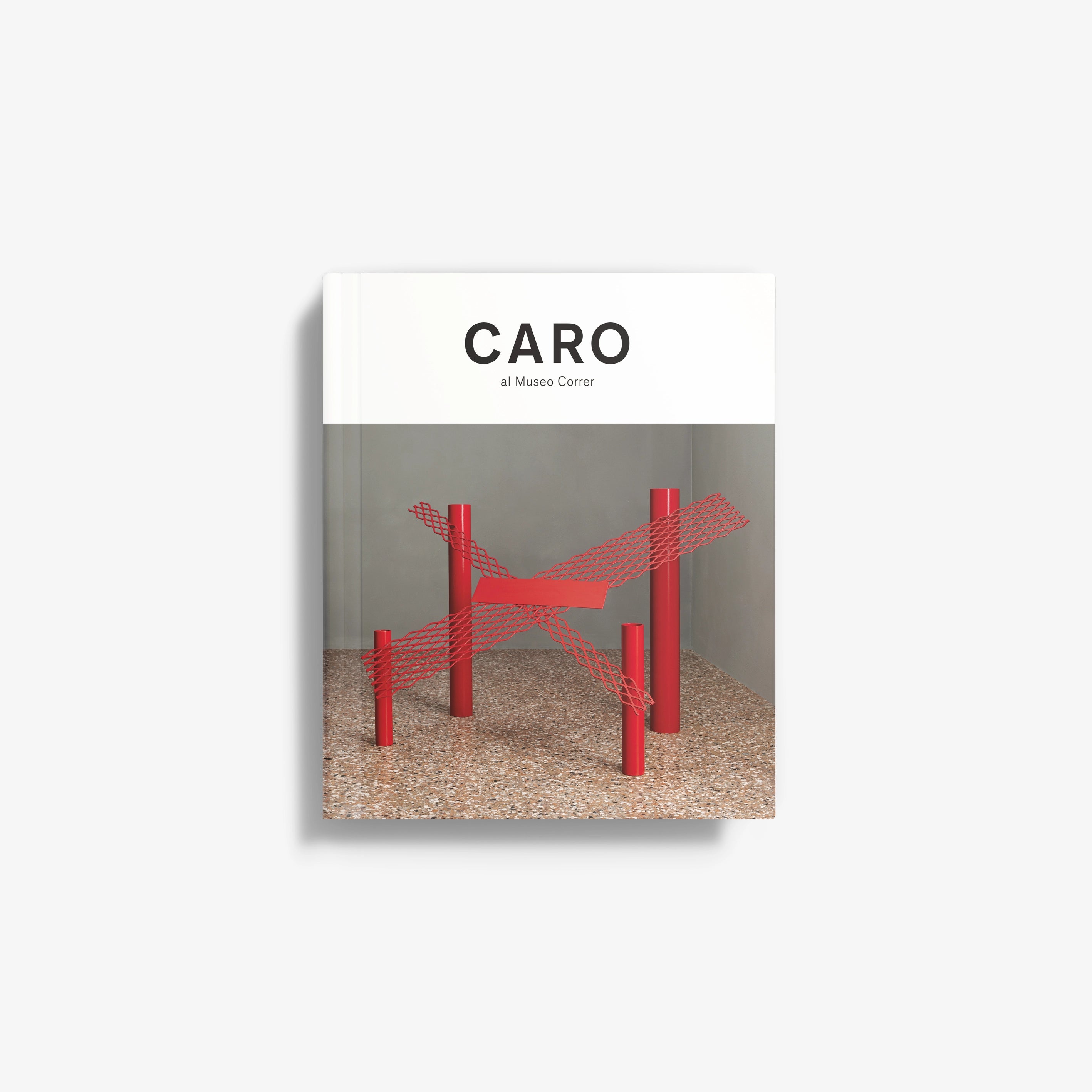 Art catalog book cover with black 'CARO' text and red abstract sculpture
