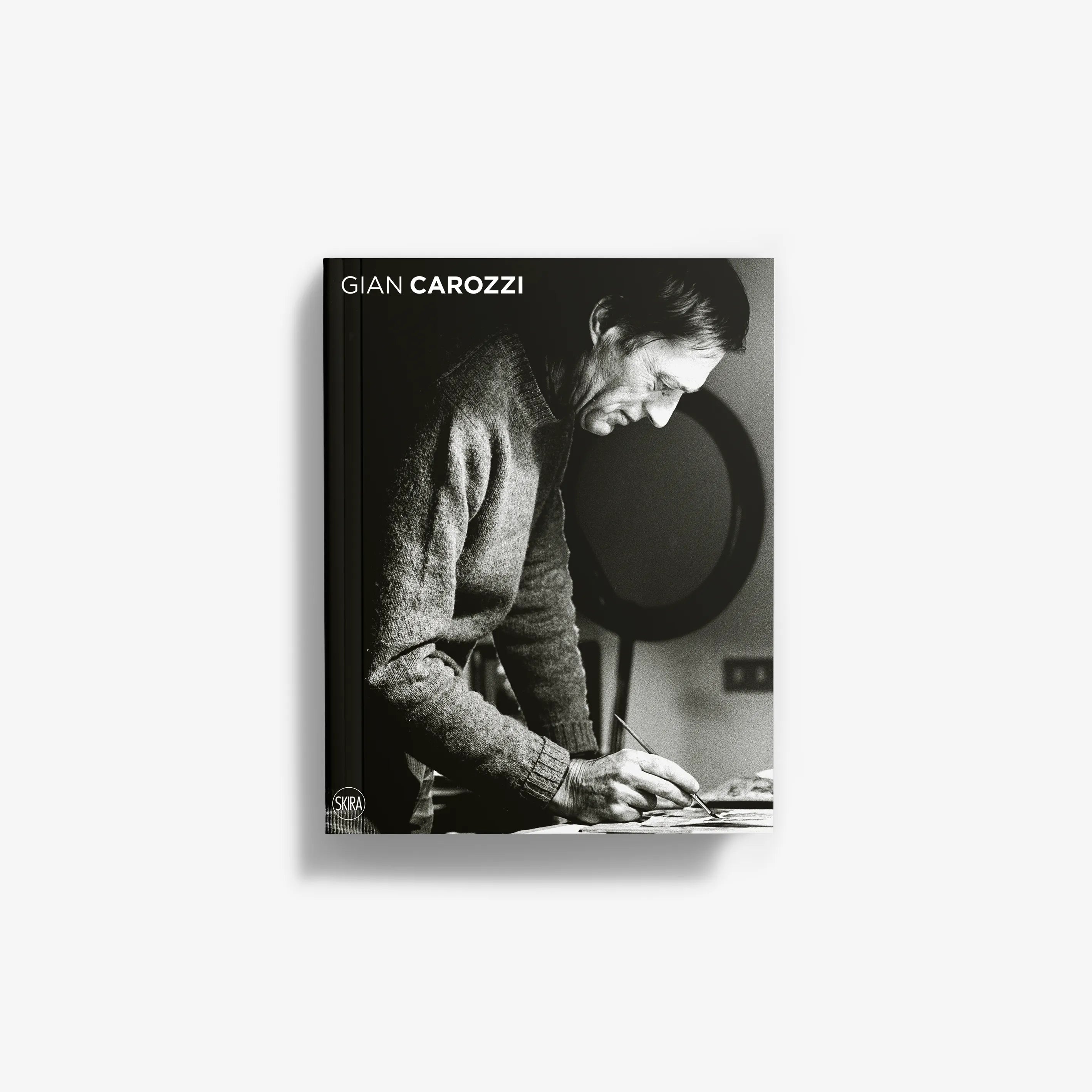 Photo book with black-and-white portrait cover and GIAN CAROZZI text