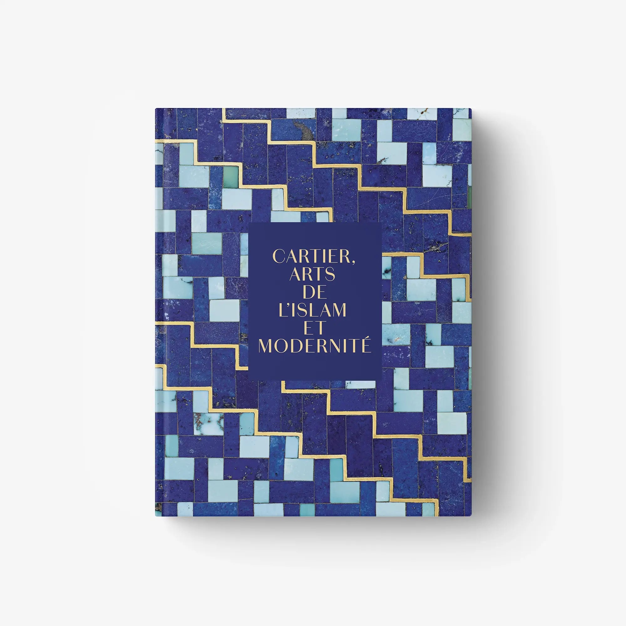 Cartier book cover with blue geometric pattern and gold-and-white title text