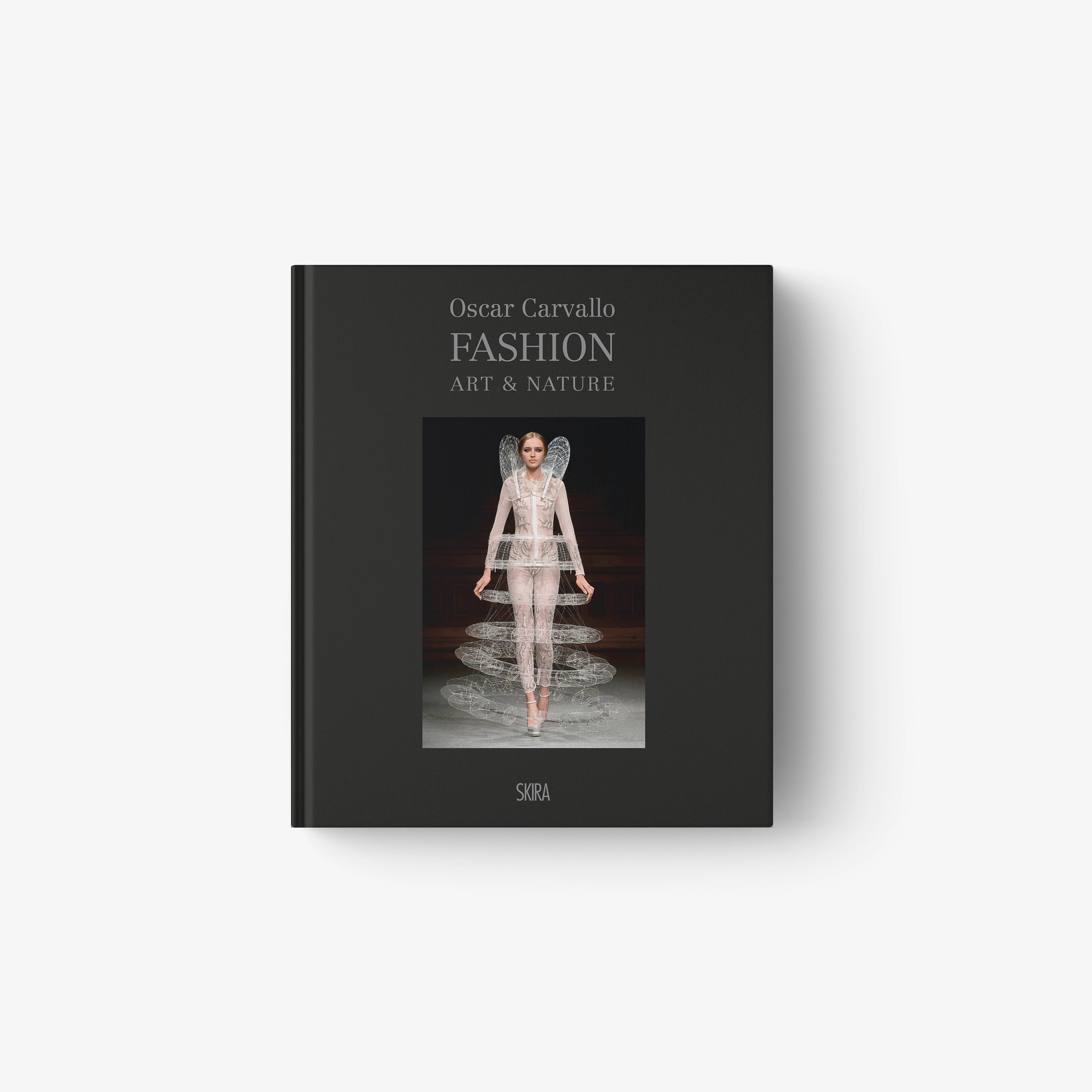 Hardcover fashion book with dark cover, model illustration, and Fashion Art & Nature title