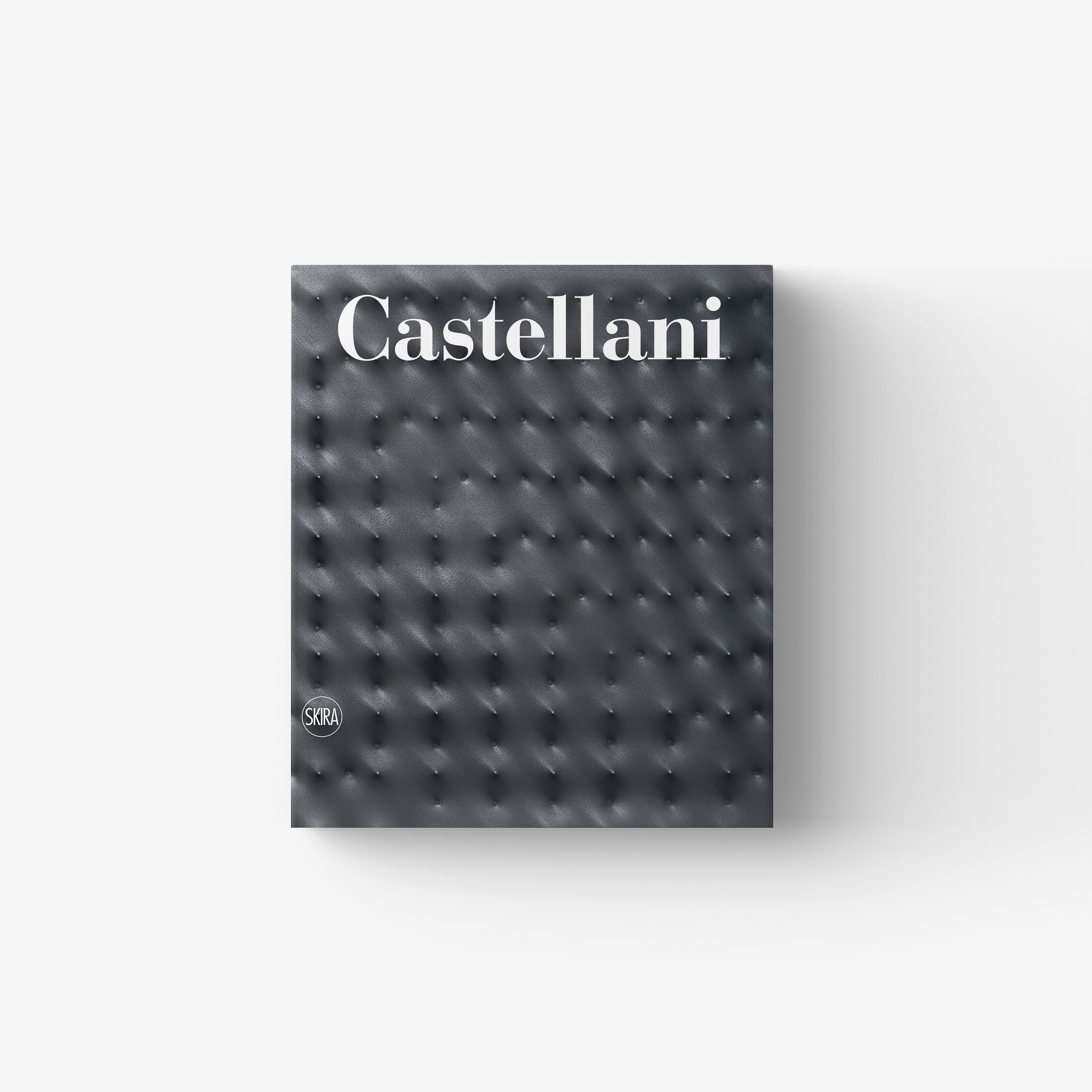 Catalogue raisonné book by Skira Arte, Enrico Castellani, dark grey leather effect cover with tufted buttons