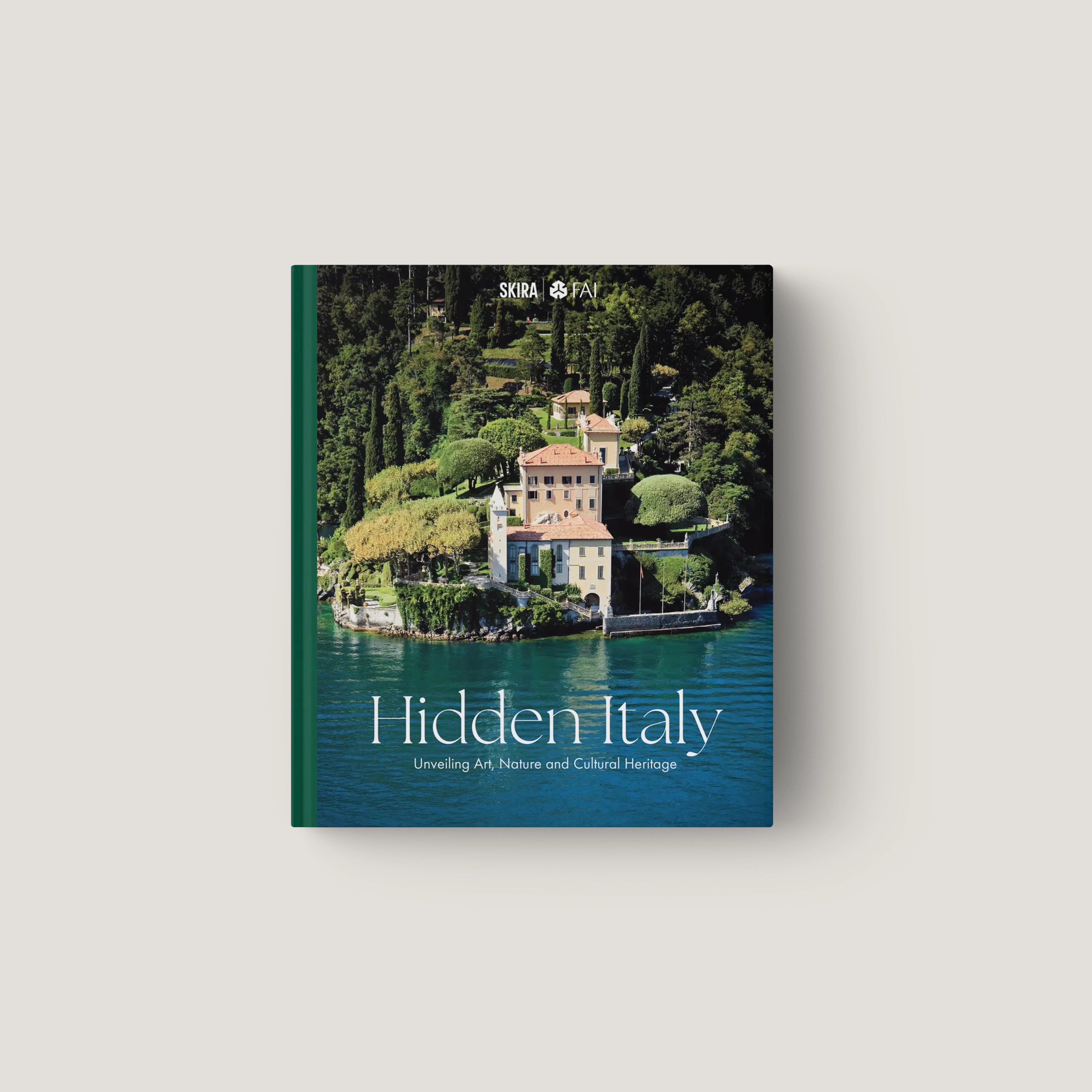 Hardcover book titled Hidden Italy with photo of lakeside villa surrounded by lush greenery and turquoise water on the cover.
