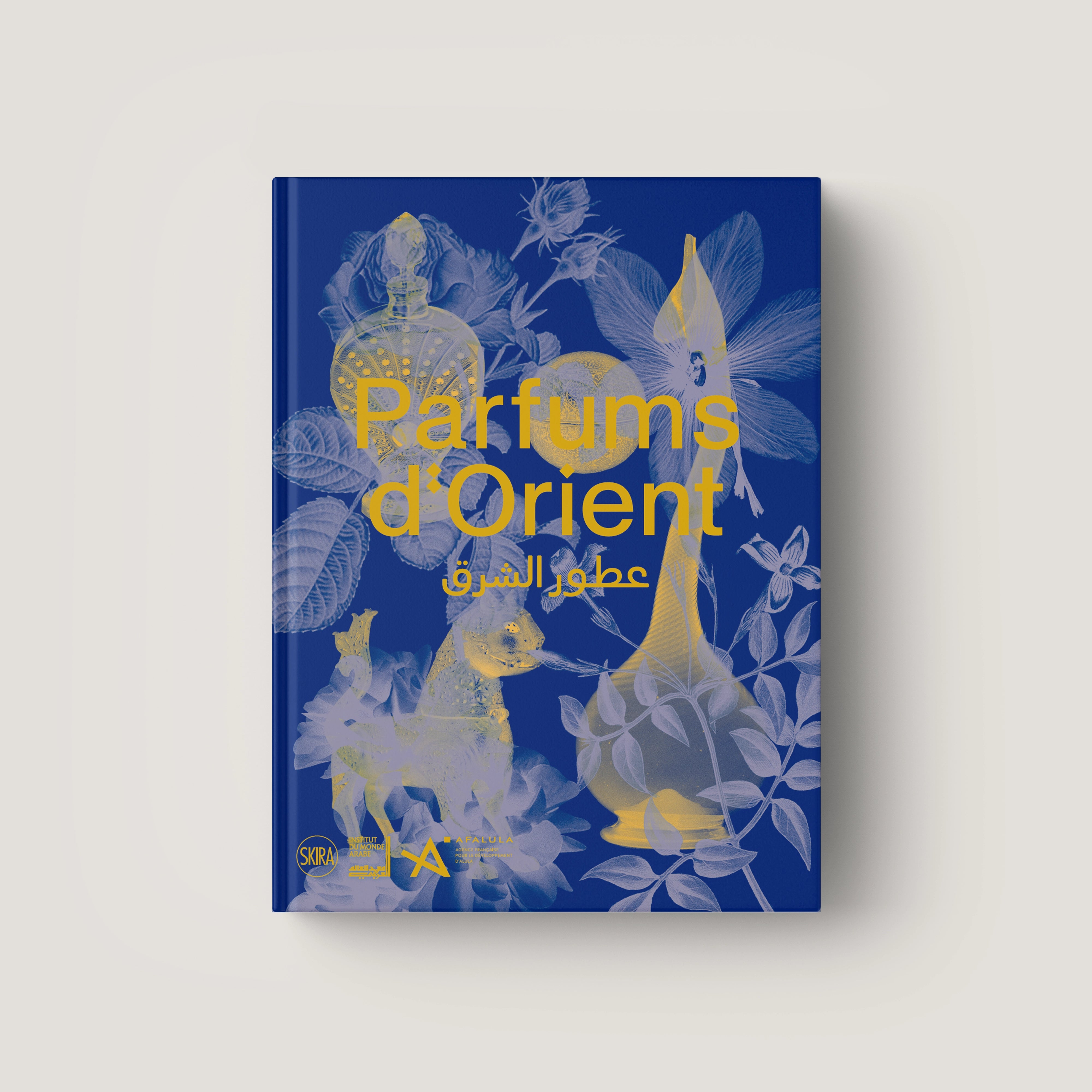 Blue hardcover book titled Parfums d'Orient with gold floral and ornamental illustrations on the cover.