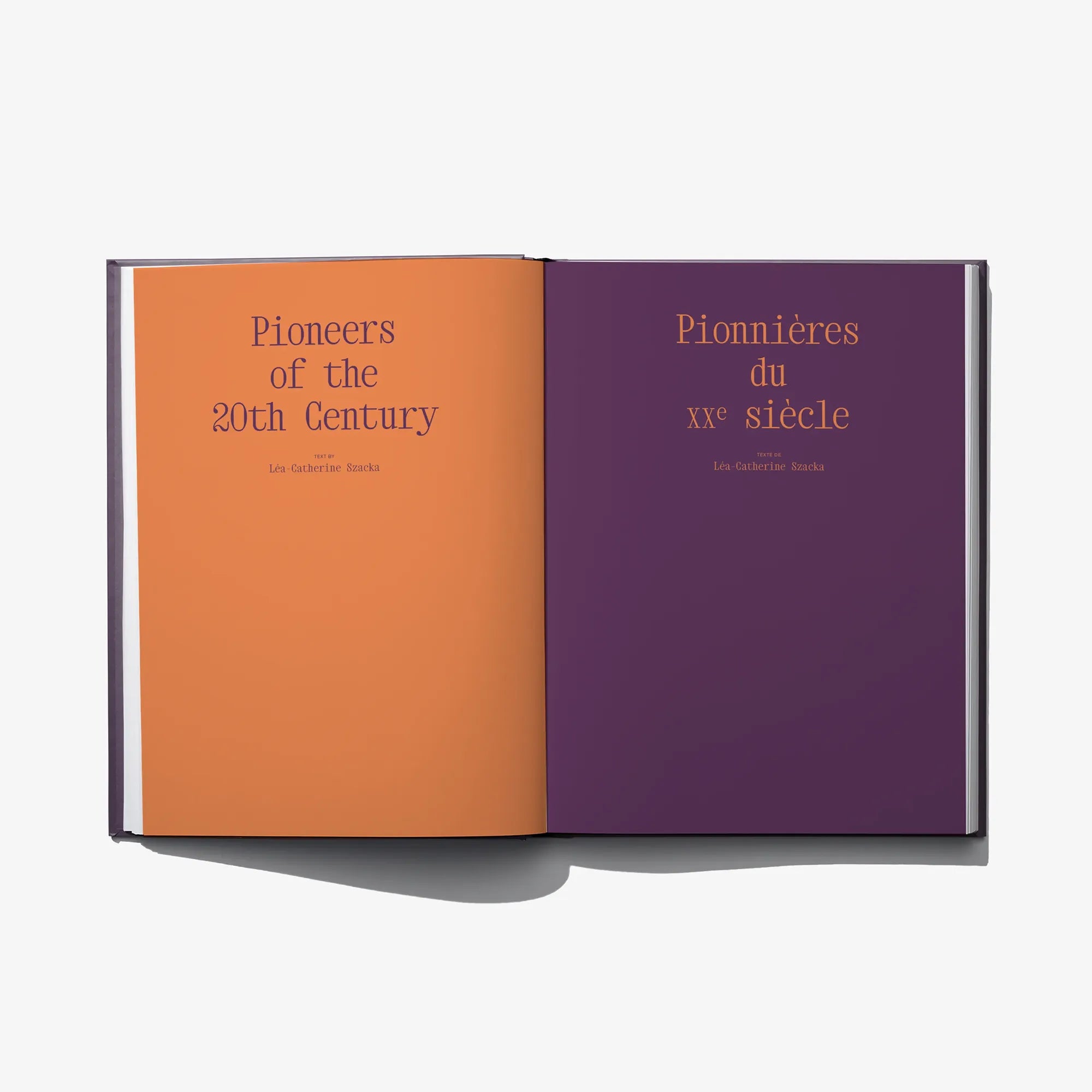 Open book with an orange left page and a dark purple right page