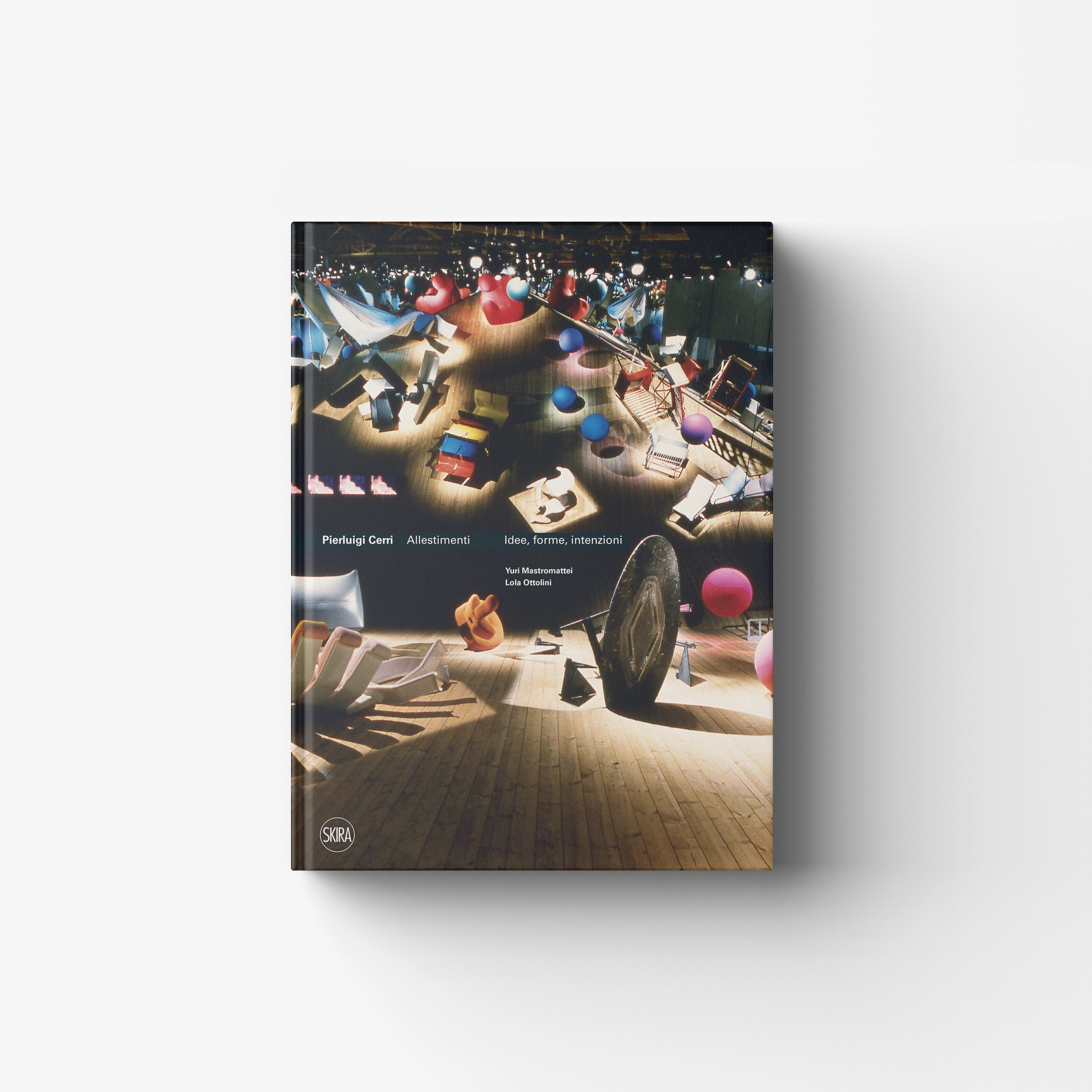 Art book with Skira Arte branding, dark cover showing exhibition installation scene with multicoloured spheres and blocks