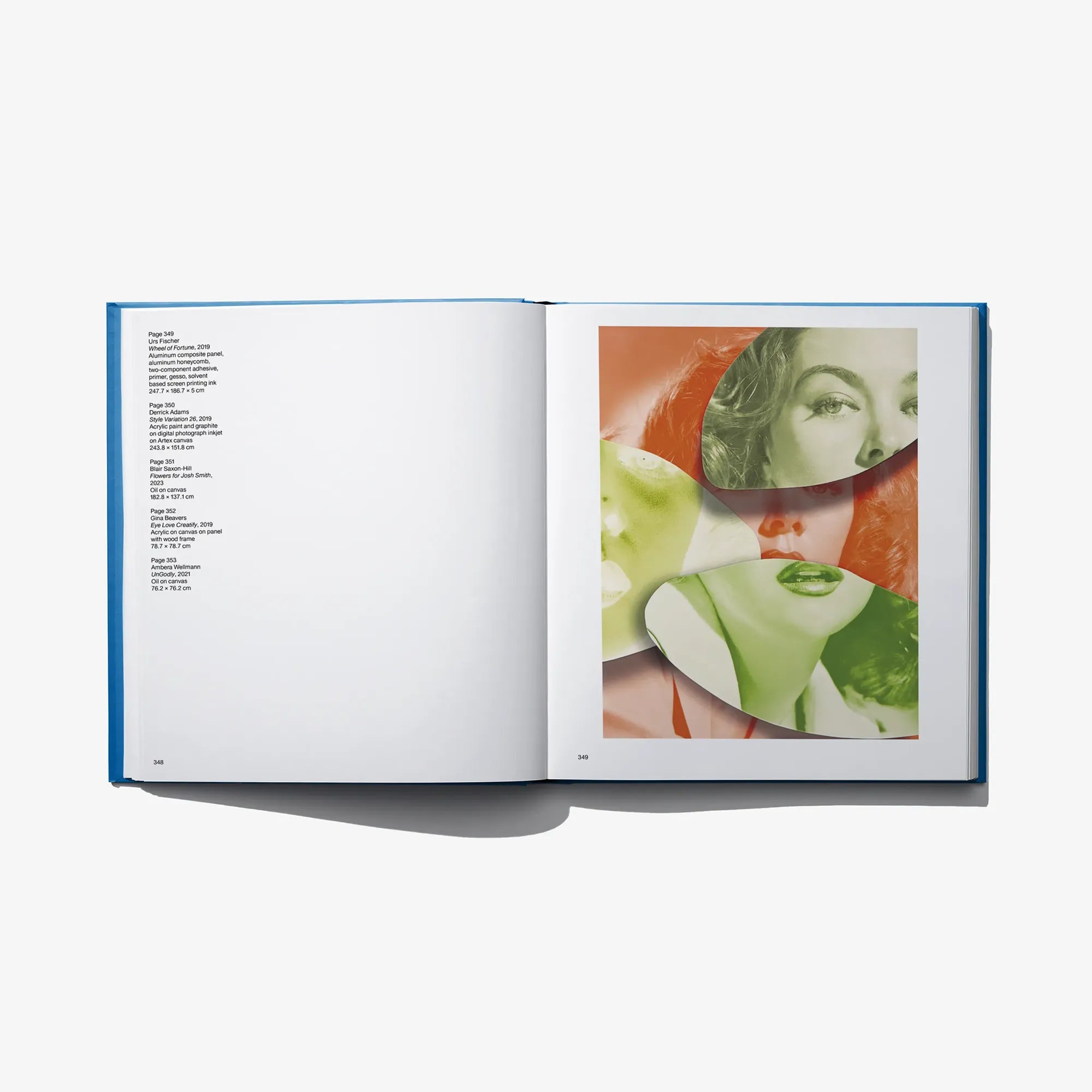 Open art book with blank left page and collage poster on right page
