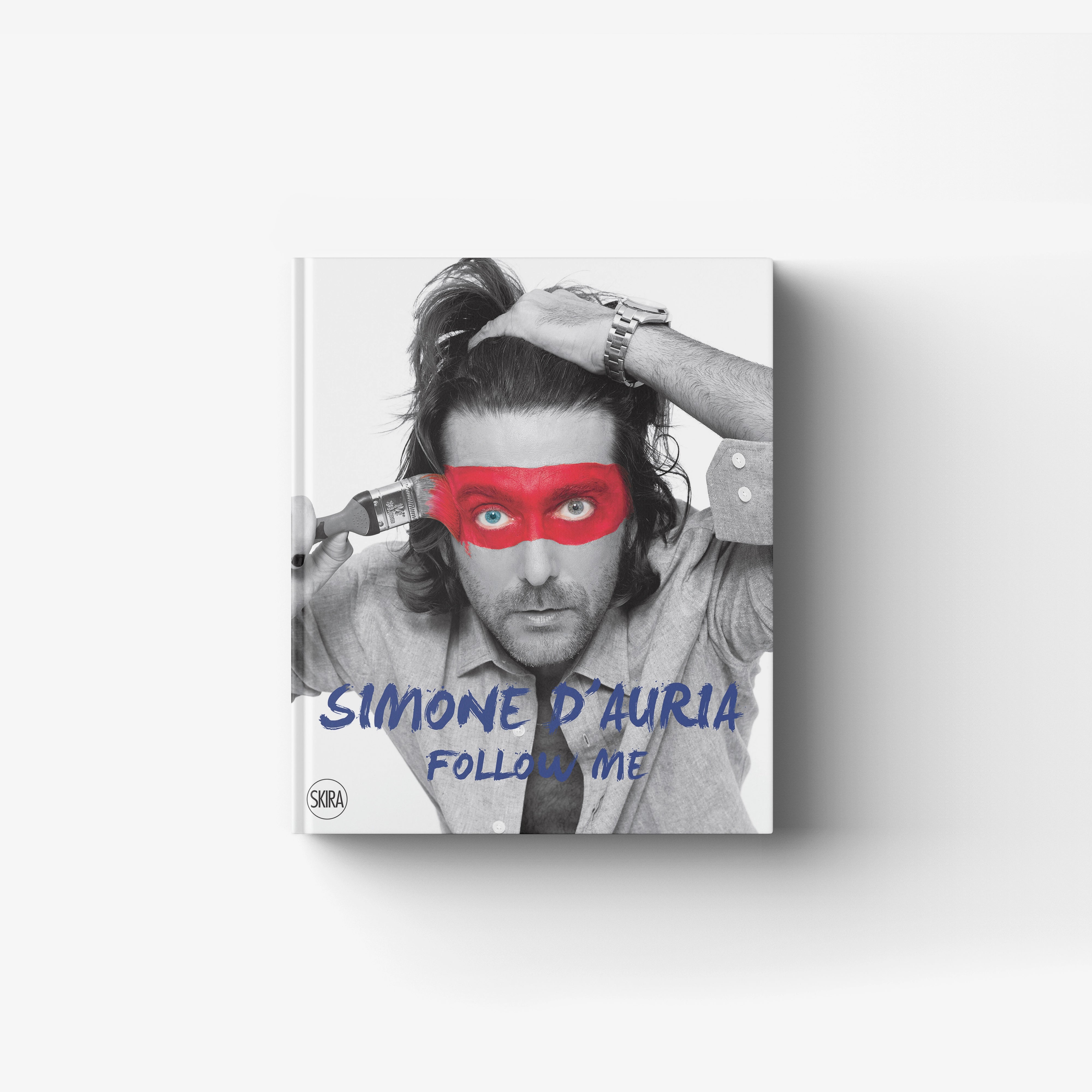 Contemporary art book cover by Skira Arte featuring Simone D'Auria, black and white portrait with red eye mask