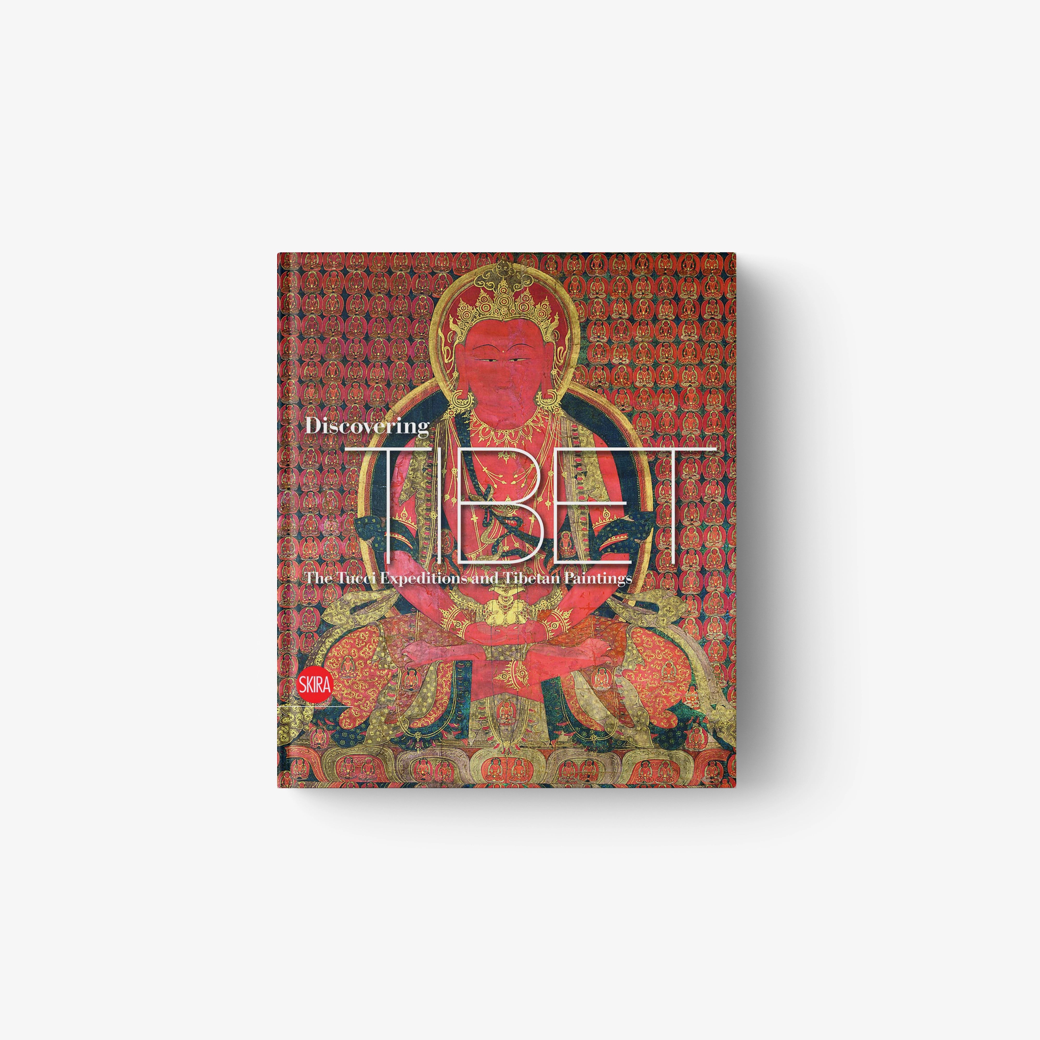 Tibet travel book with ornate red patterned cover featuring seated figure illustration