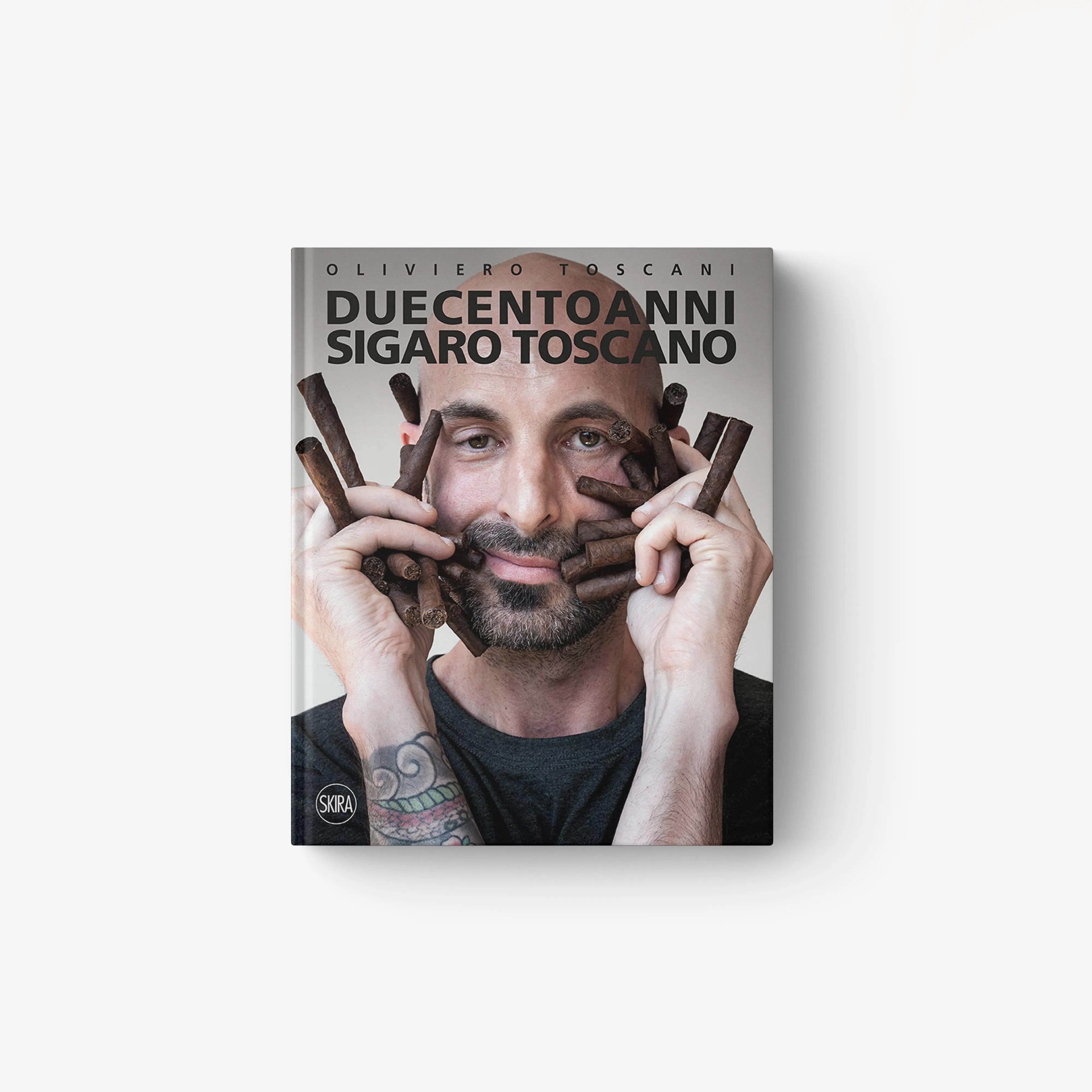 Hardback book by Skira Arte with a man holding cigars, cover text Duecento anni Sigaro Toscano