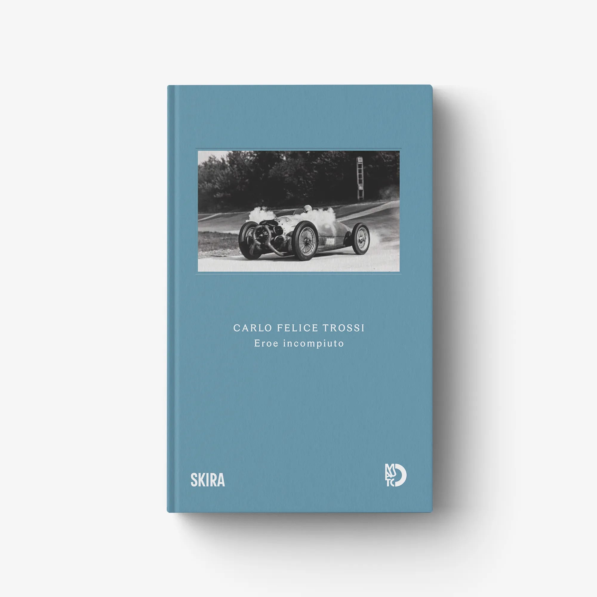 Blue hardcover book with mounted photo and title on front cover