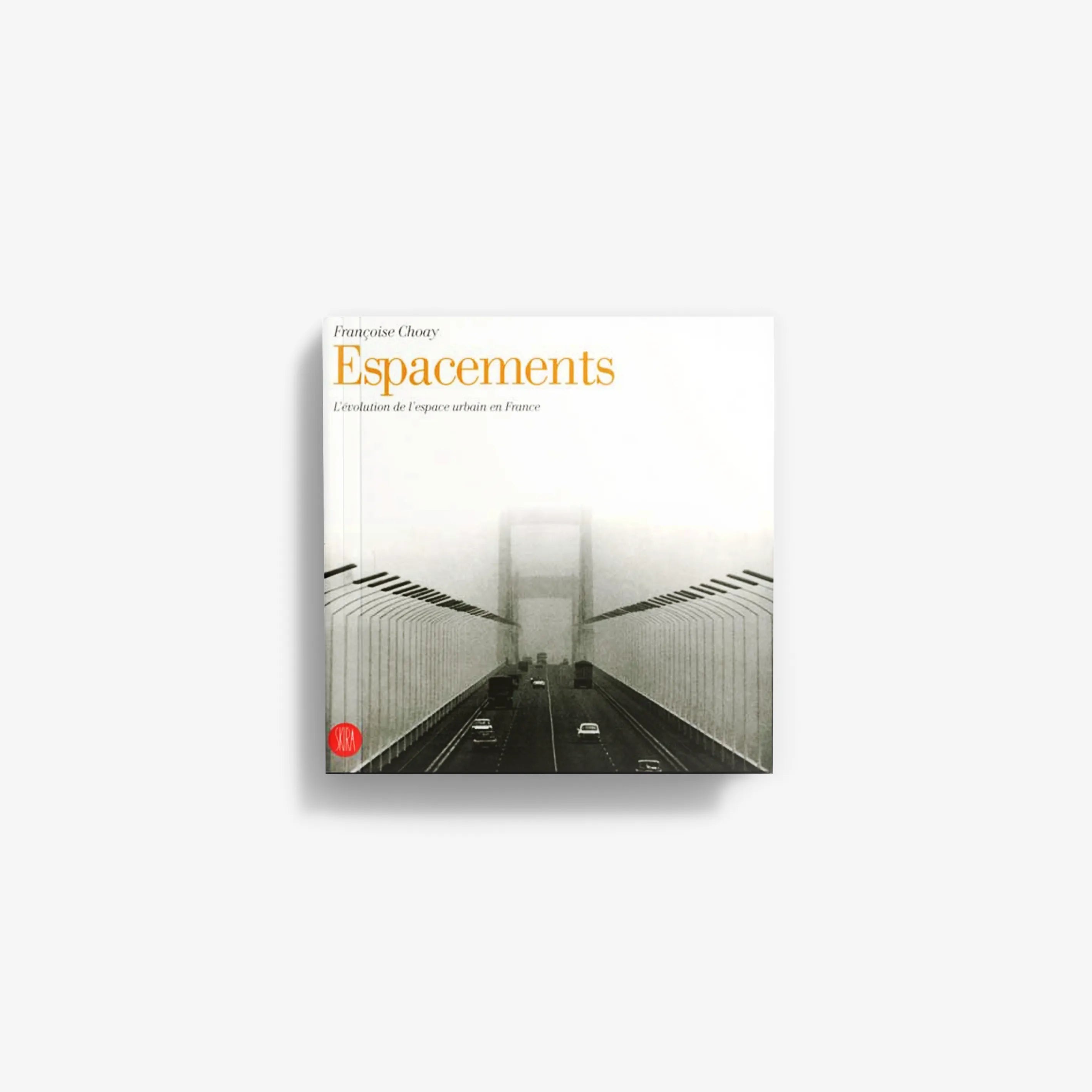 Book titled 'Espacements' with yellow cover and black-and-white road tunnel artwork