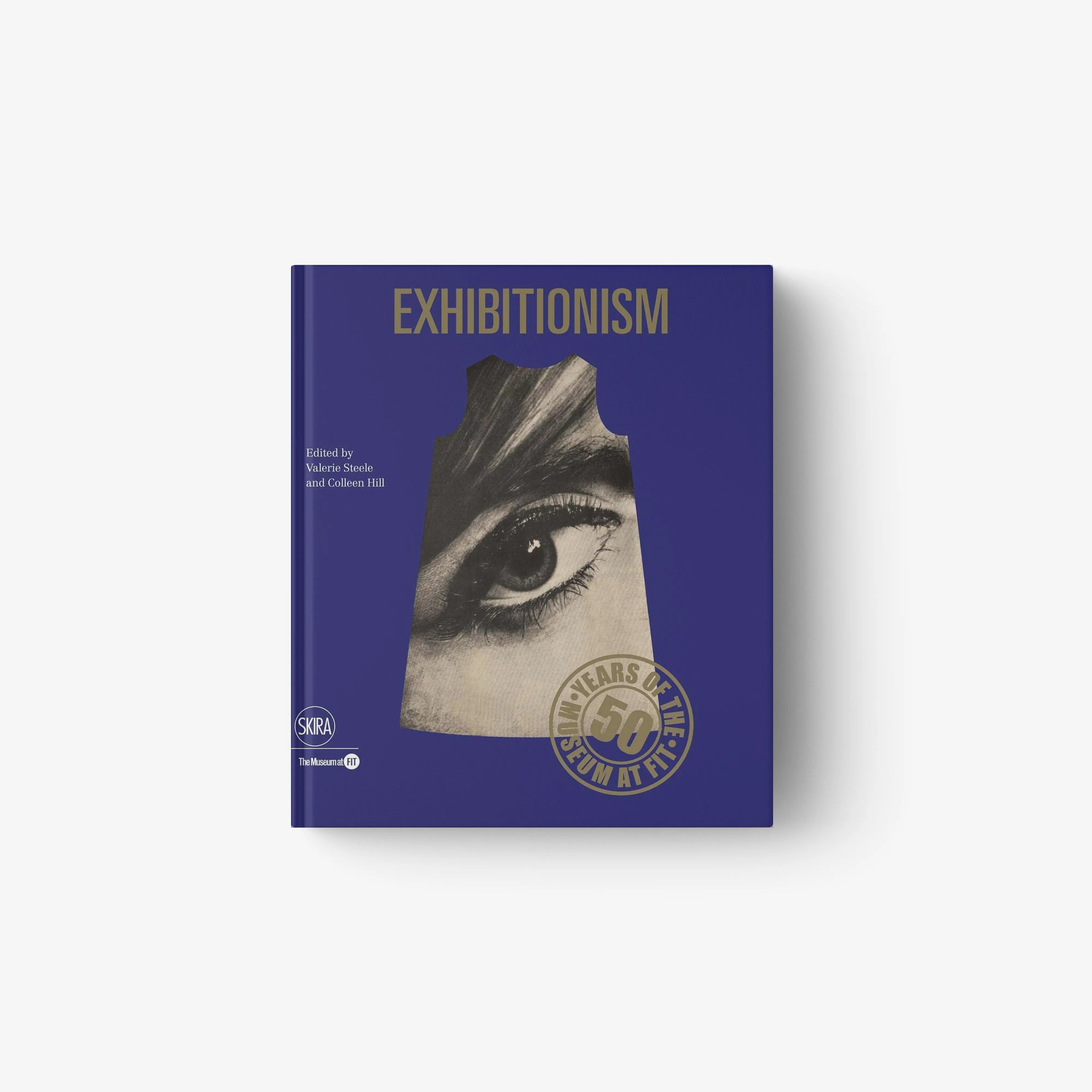Fashion museum exhibition book in deep purple with Skira Arte branding, 50 years of Museum at FIT