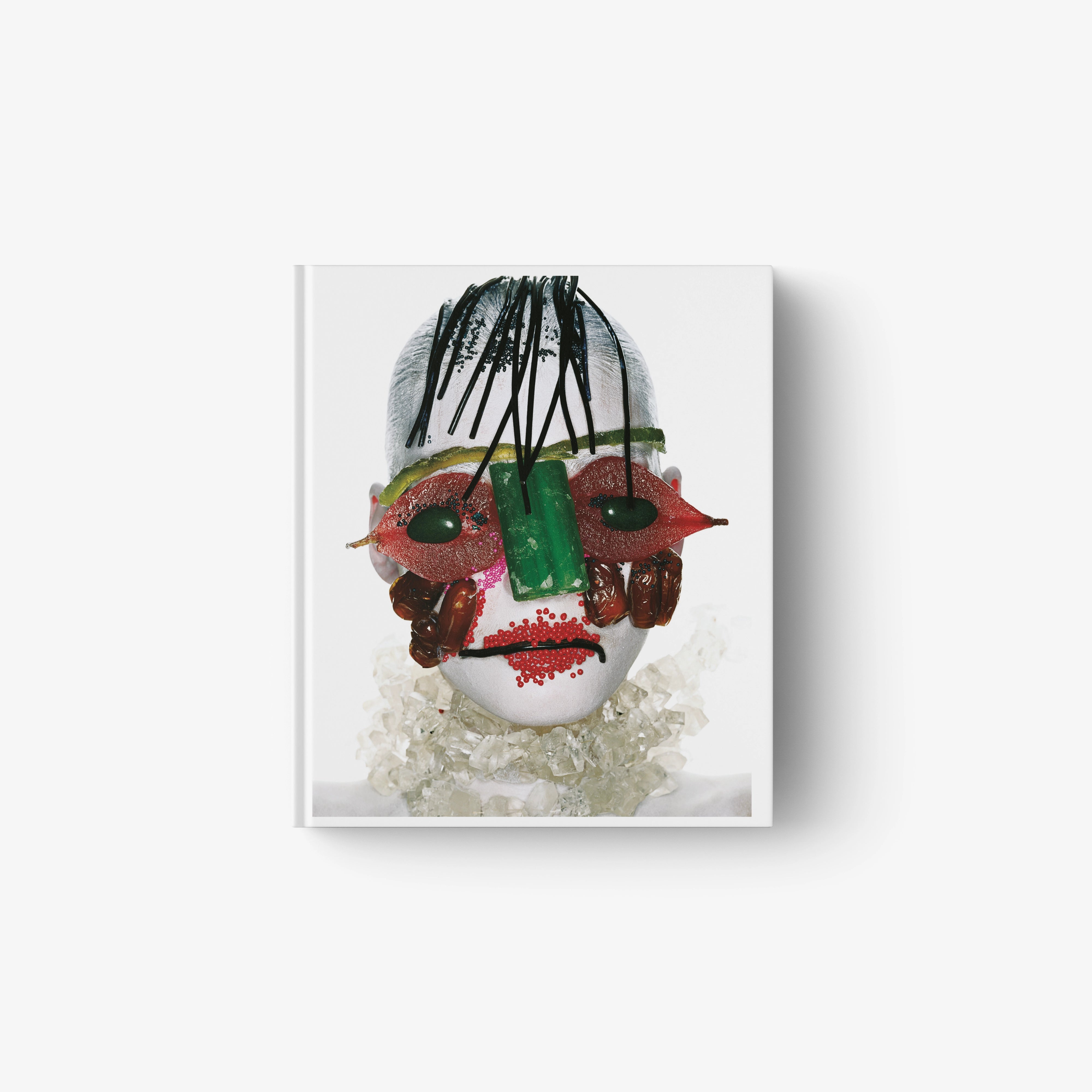 Hardcover fashion photo book with colorful illustrated portrait cover