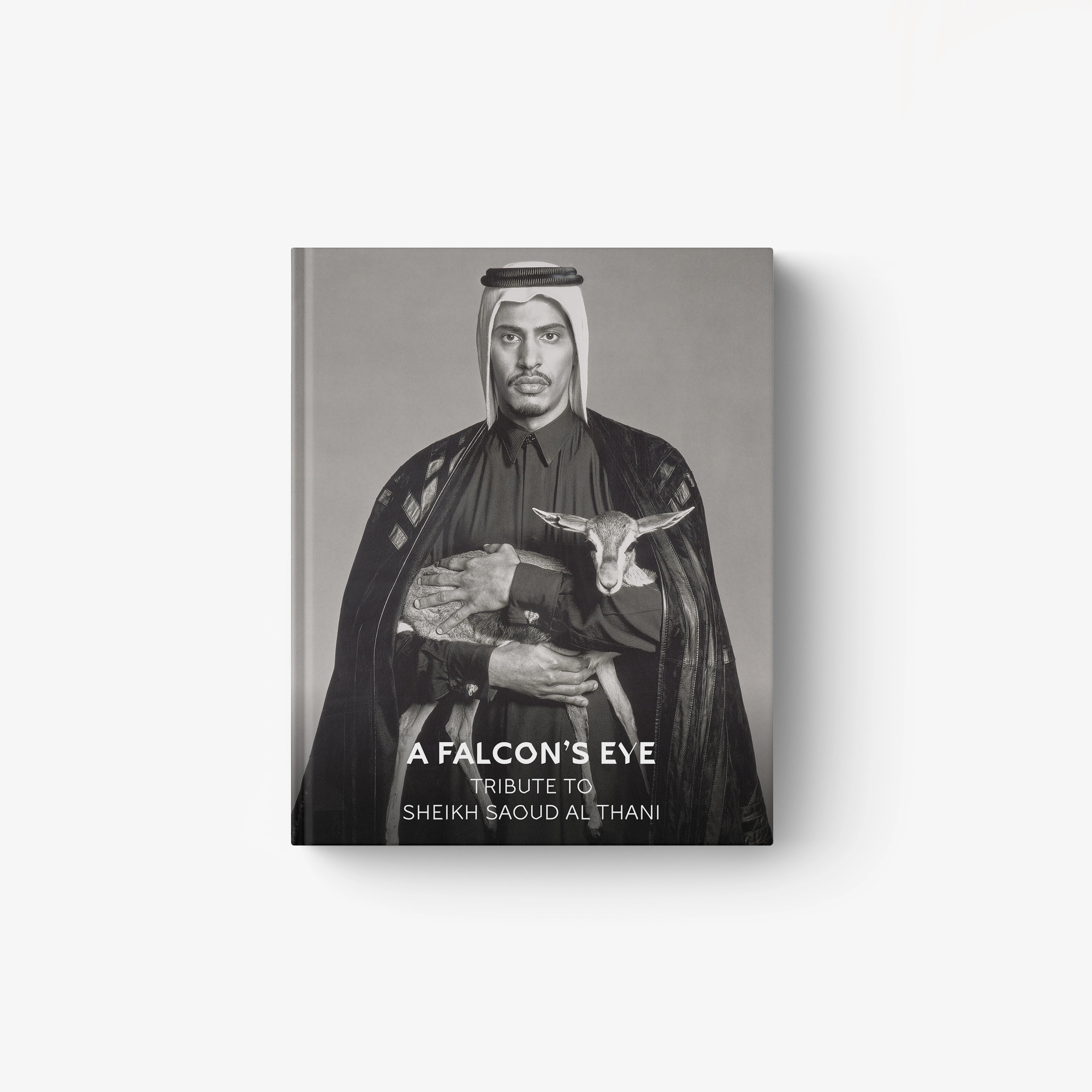 Monochrome portrait of Sheikh Saoud Al Thani holding a falcon, titled A Falcon’s Eye book cover.