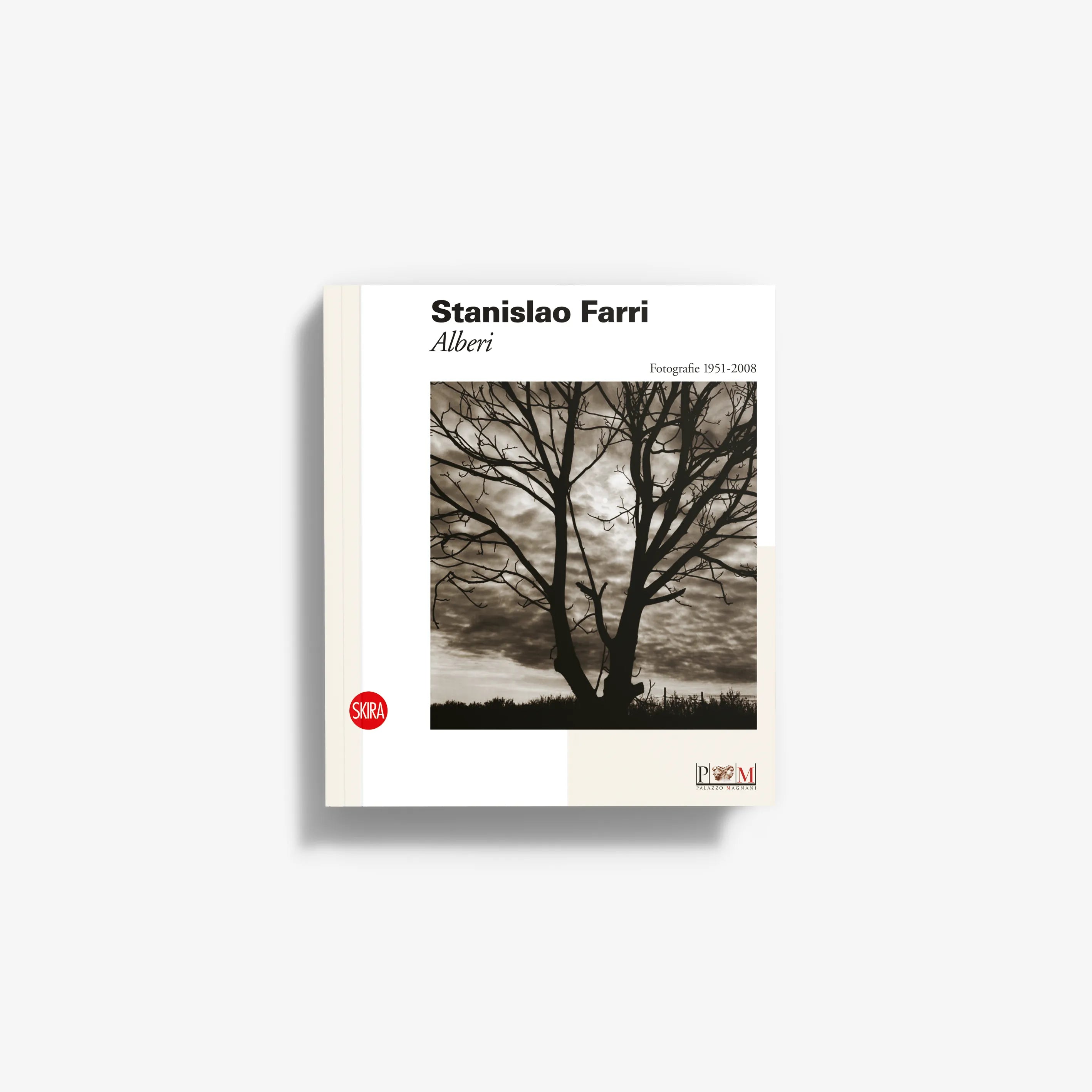 Photo book cover with tree landscape, cream border, title and author text