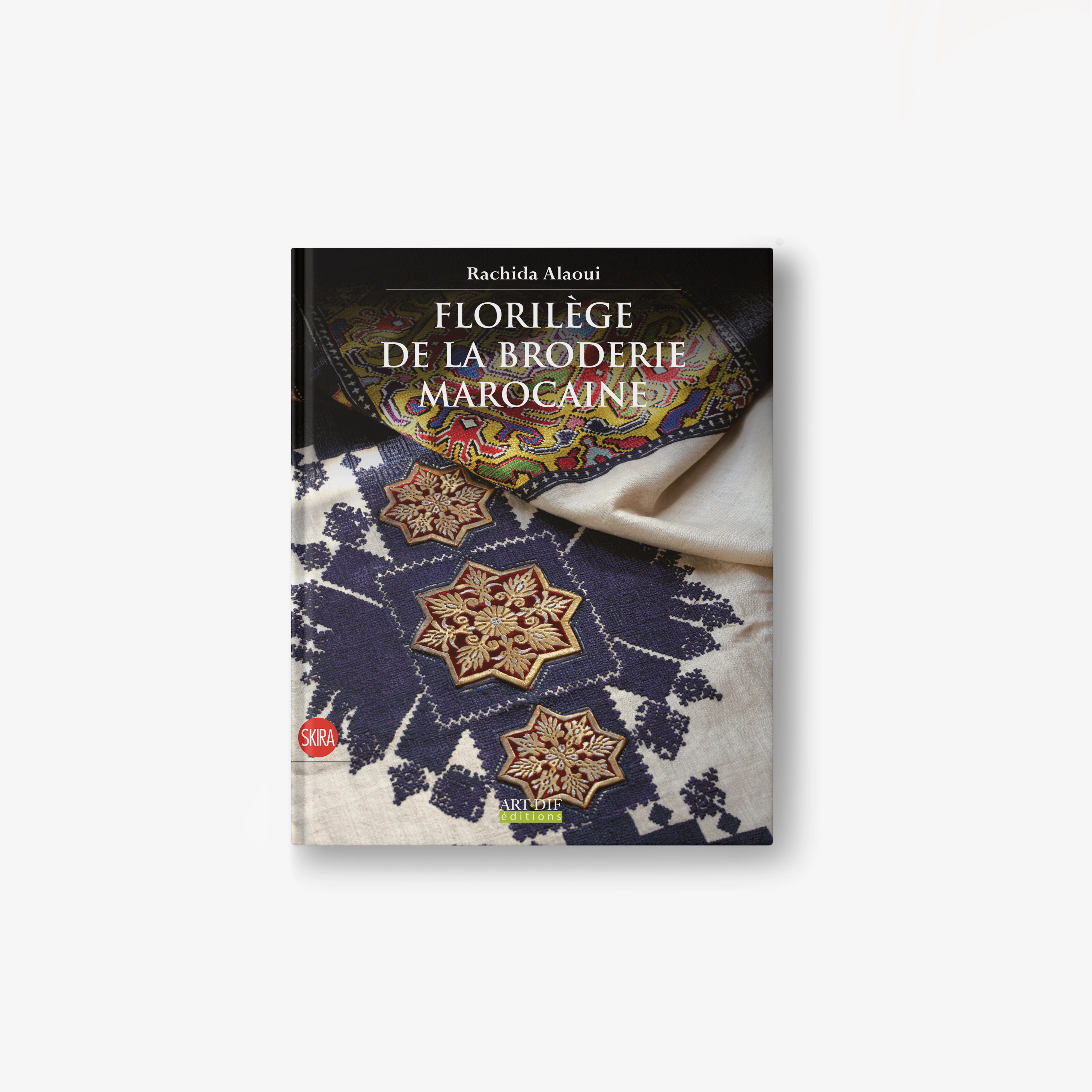 Moroccan embroidery anthology book with ornate blue and gold stitch patterns on cover