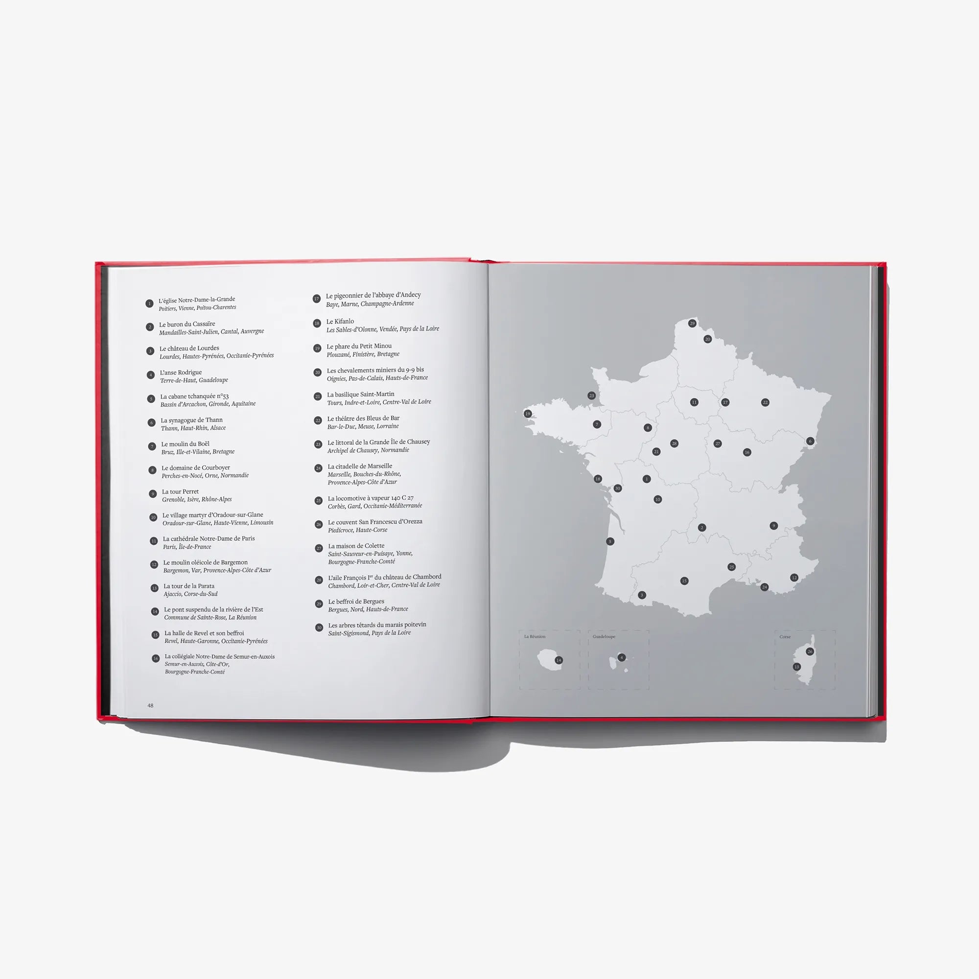 Open book spread with gray map of France and labeled points