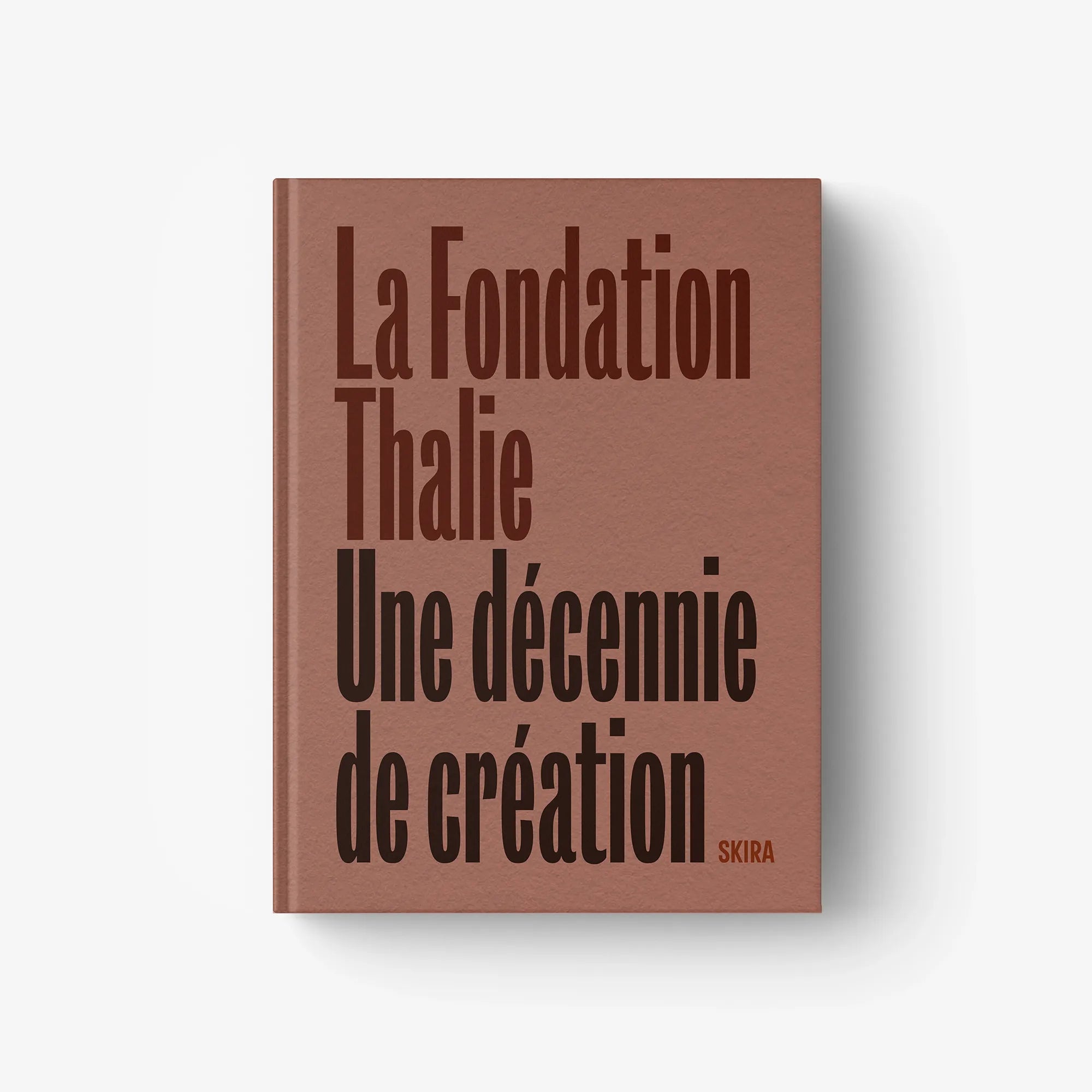 Brown hardcover book with “La Fondation Thalie” and “A Decade of Creation” title