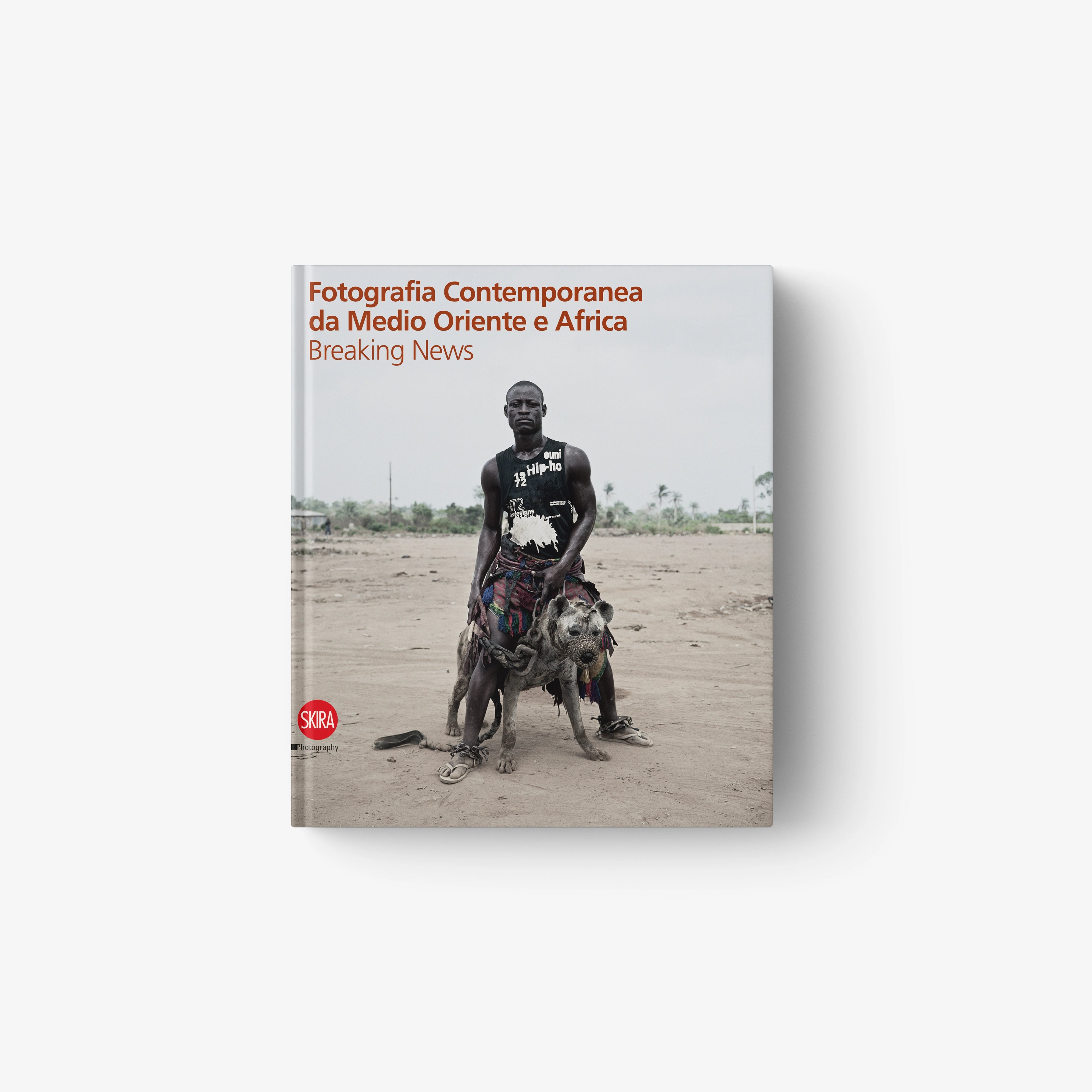 Contemporary photography book cover with man and dog in sandy outdoor scene