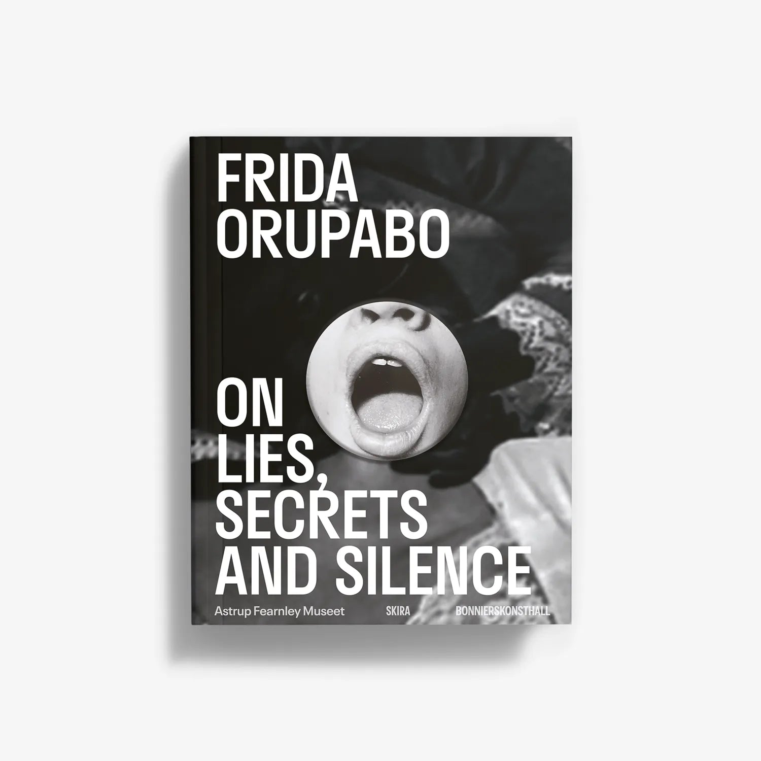 Monochrome photo book cover with face close-up and large title typography