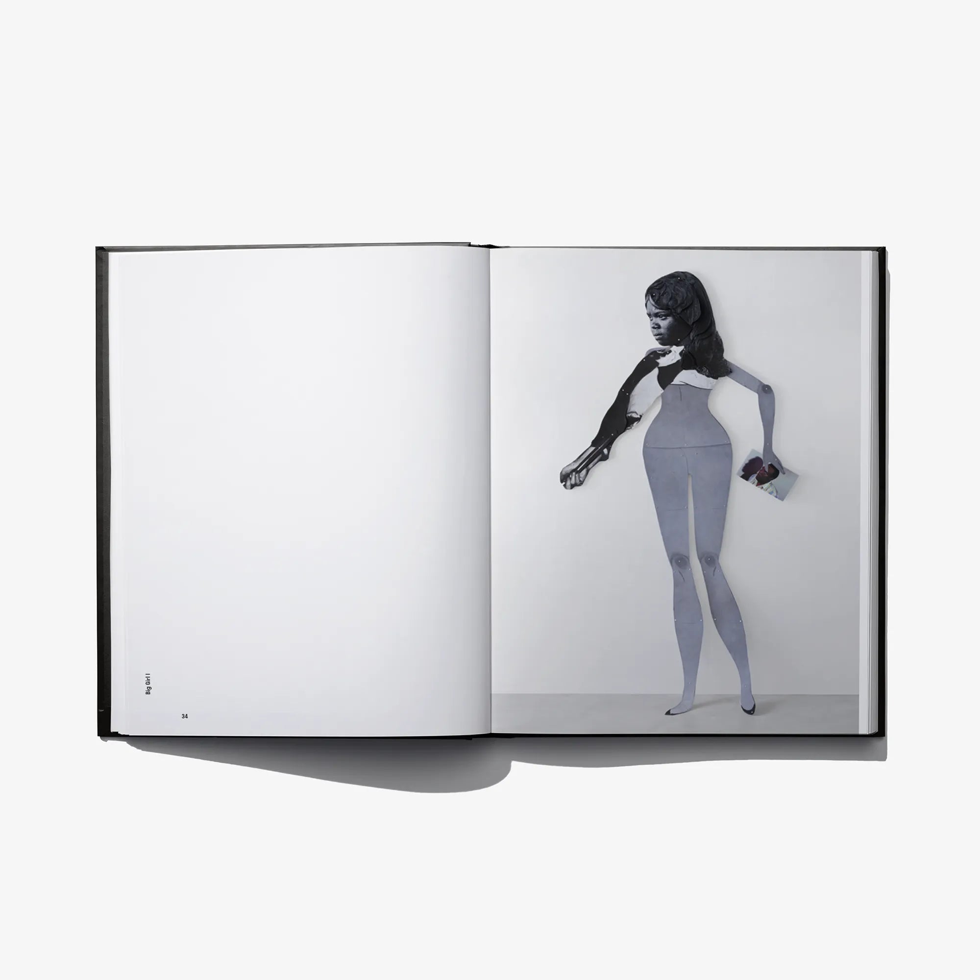 Open photo book spread with full-body portrait and plain white opposite page