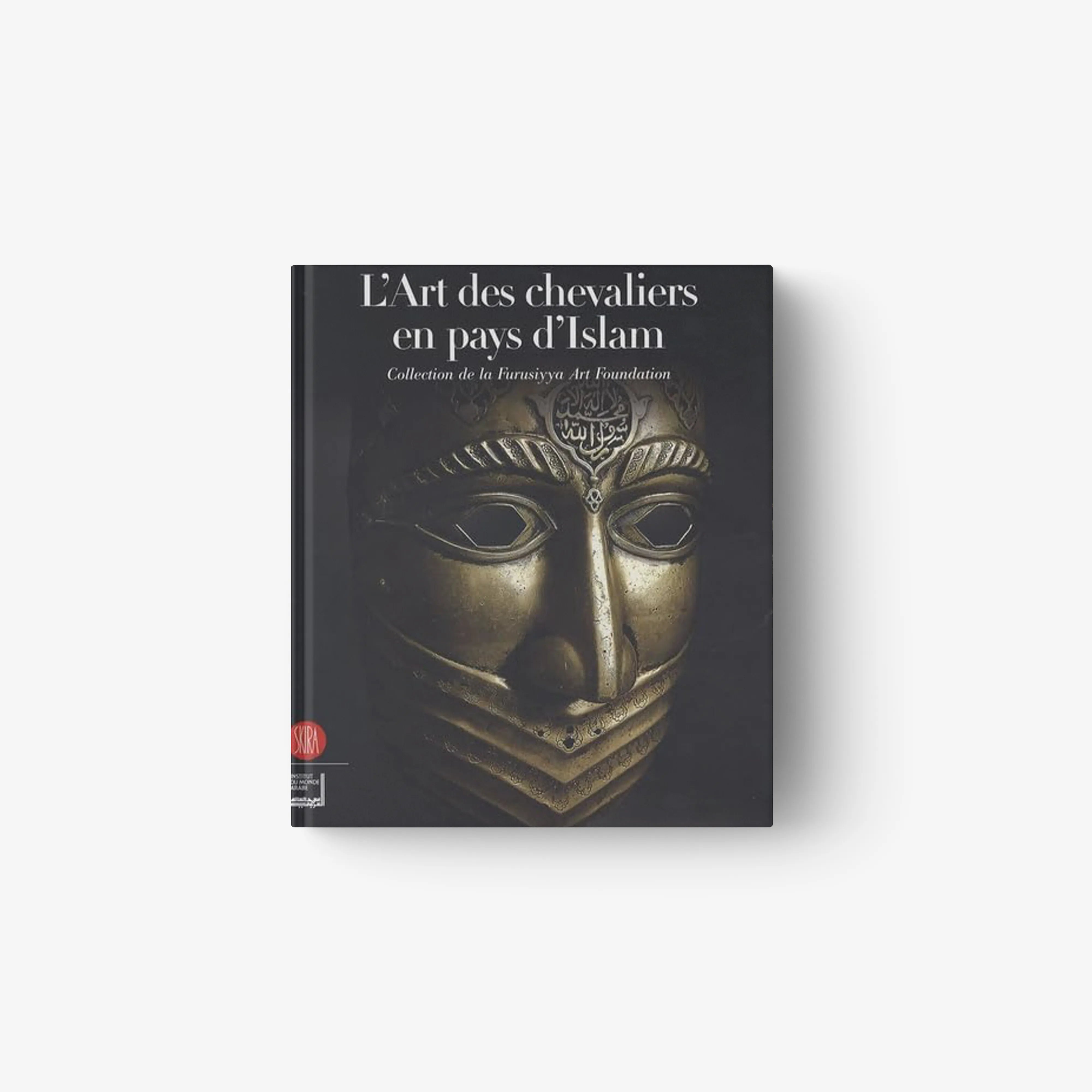 Hardcover book with dark cover and gold decorative face mask