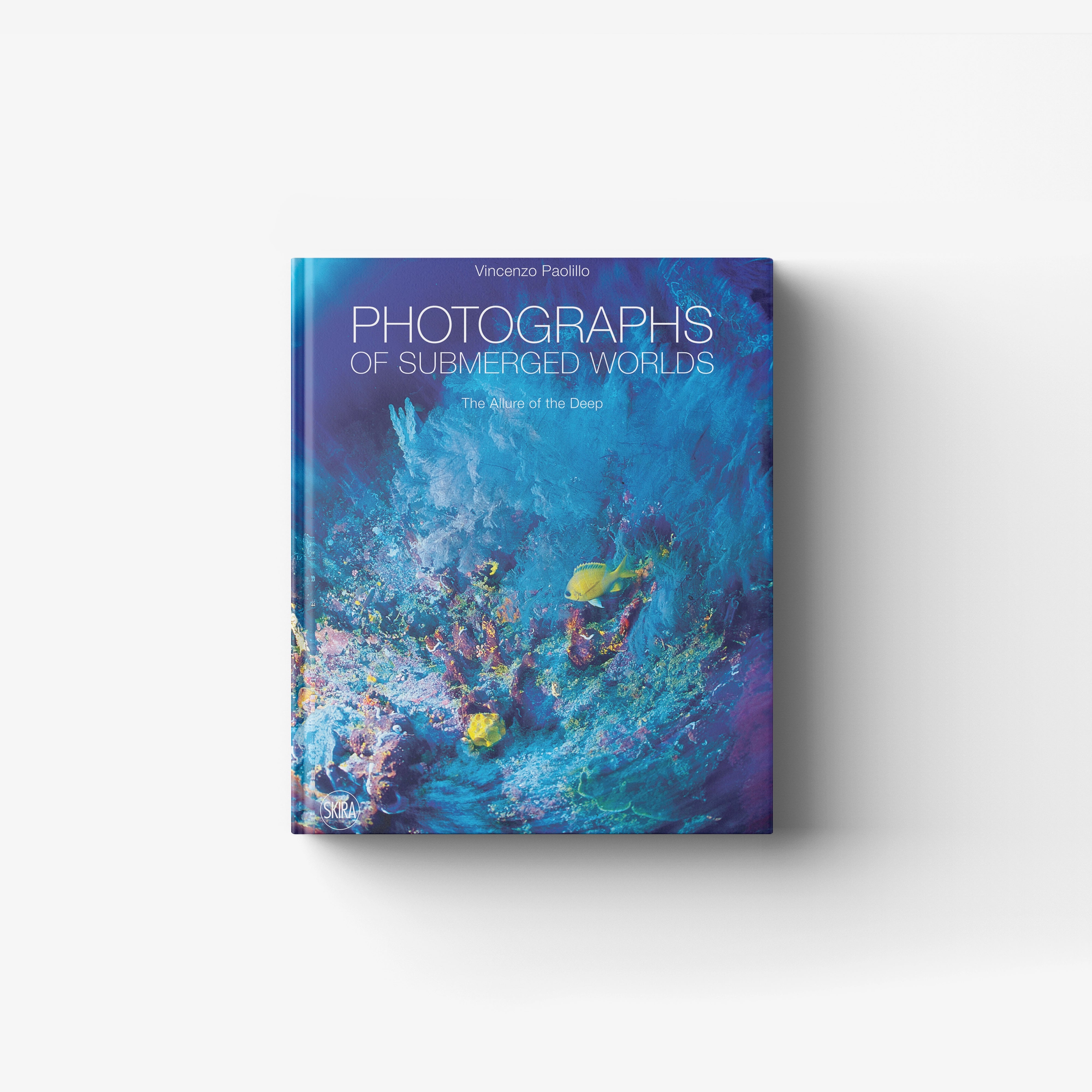 Underwater marine and freshwater photography book by Skira Arte, blue and purple cover with deep sea fish
