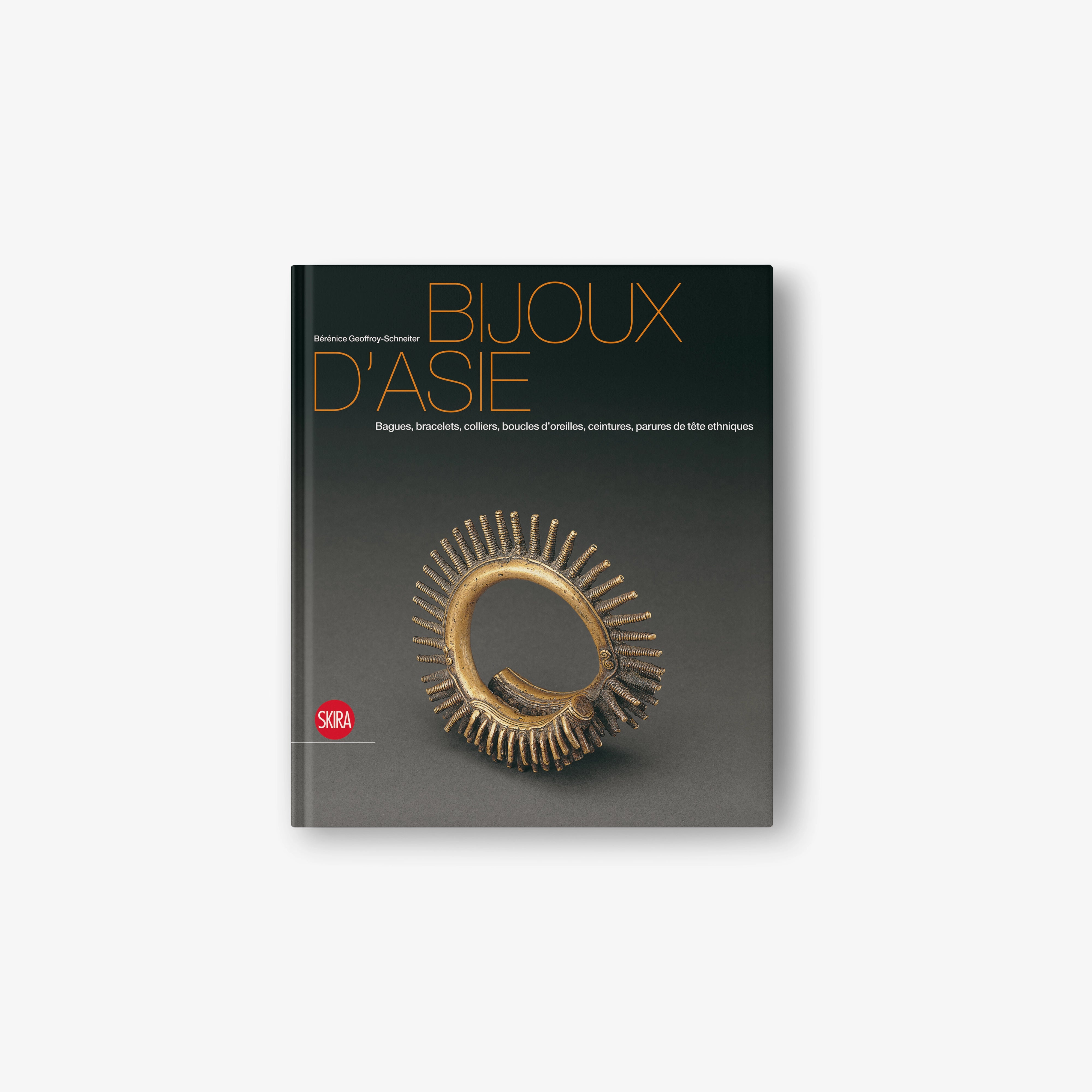 Jewels of Asia jewelry book cover with gold circular pendant illustration