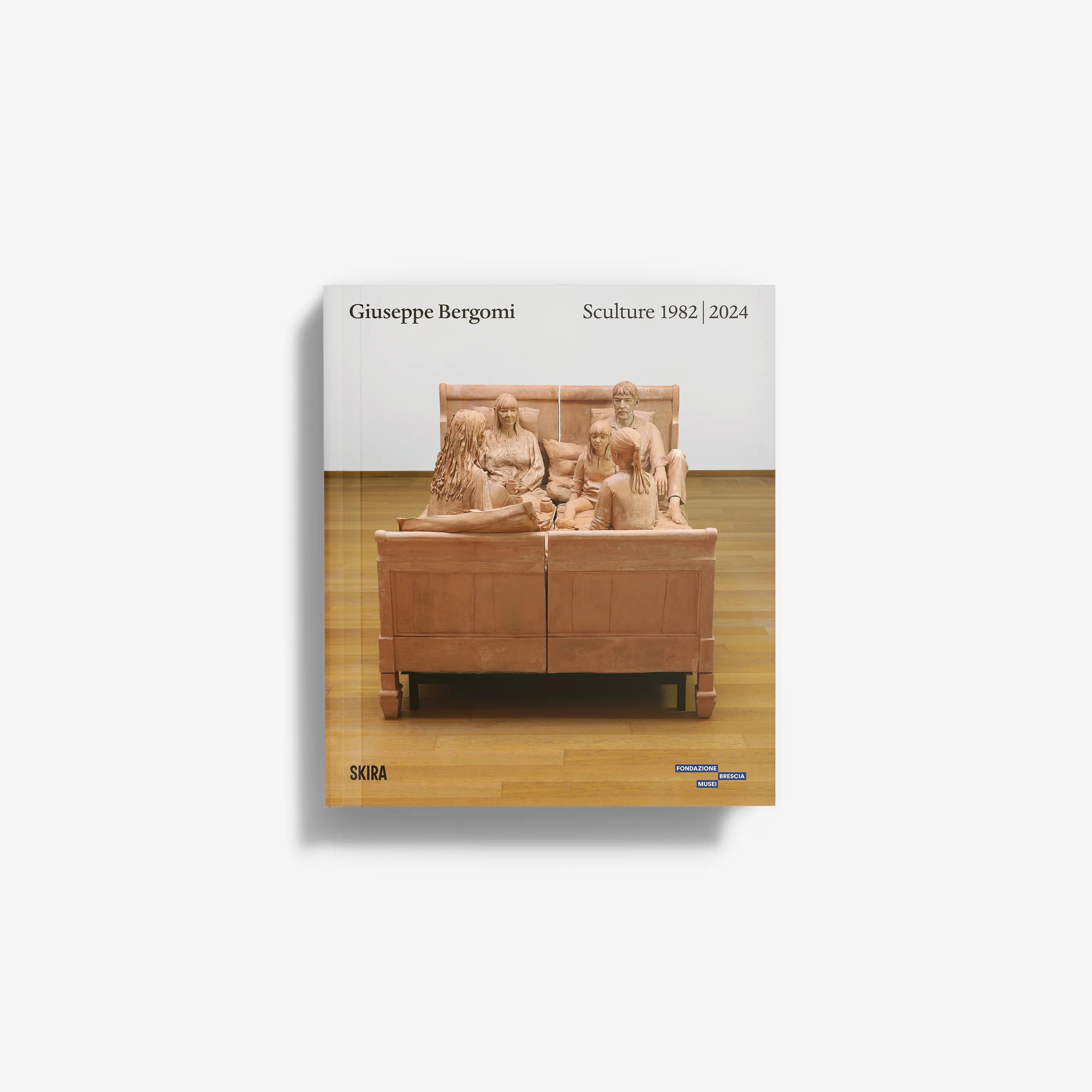 Contemporary art monograph by Skira Arte with bronze and terracotta policroma sculptures, showing a group on a sofa